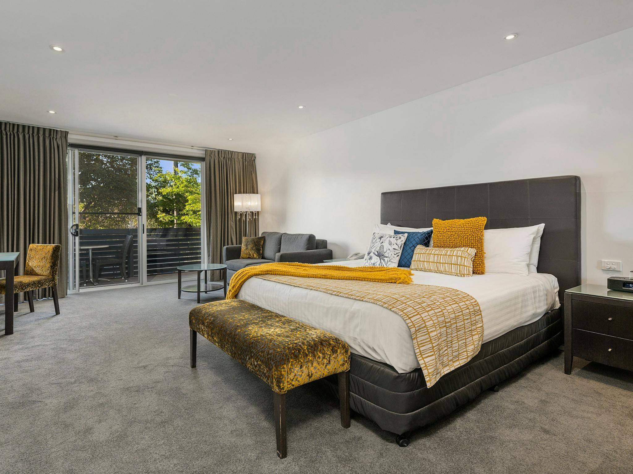 he Gateway's King Suites offer views of treetops from your private balcony
