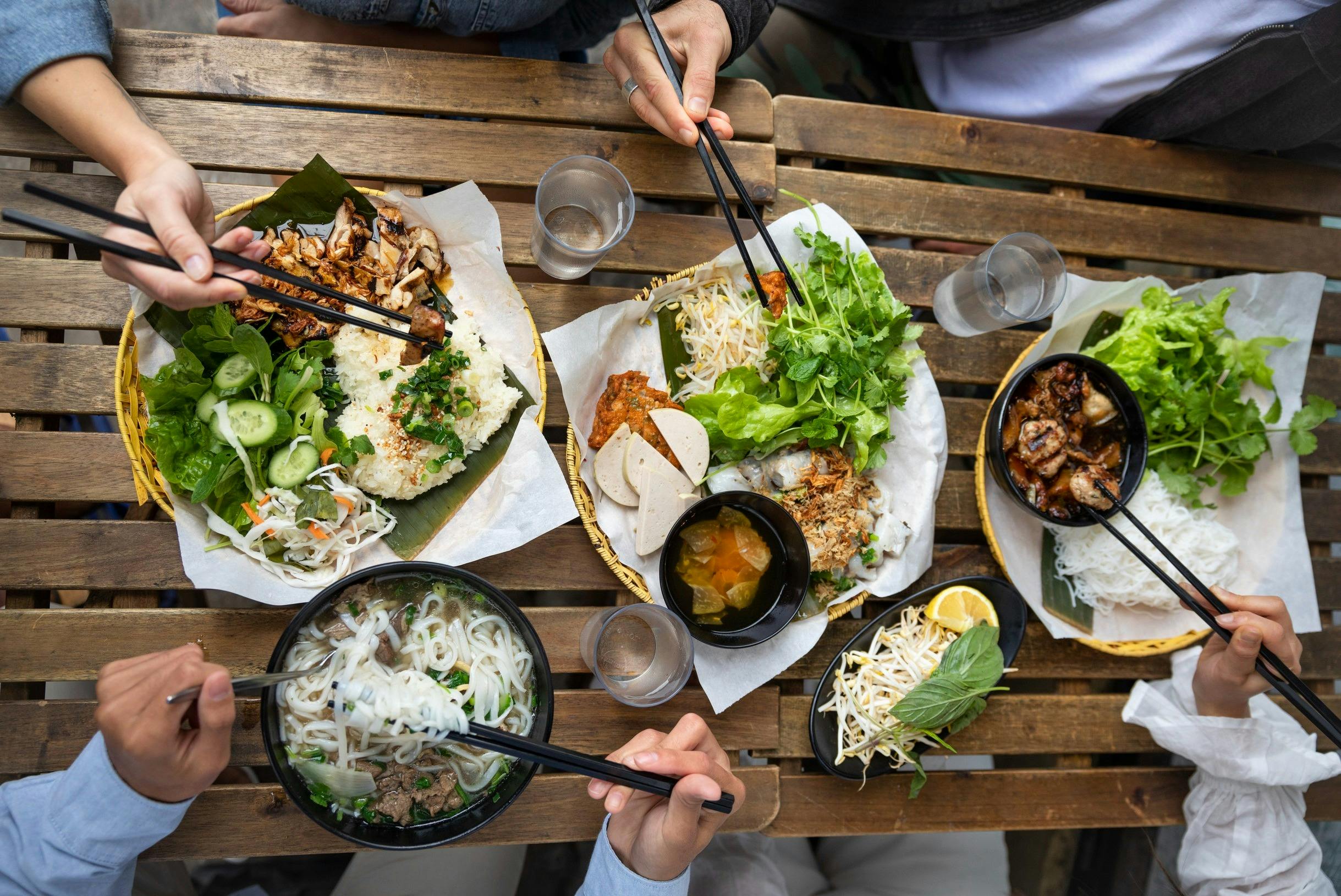 Couple enjoying food and drink at VN Street Foods, Marrickville