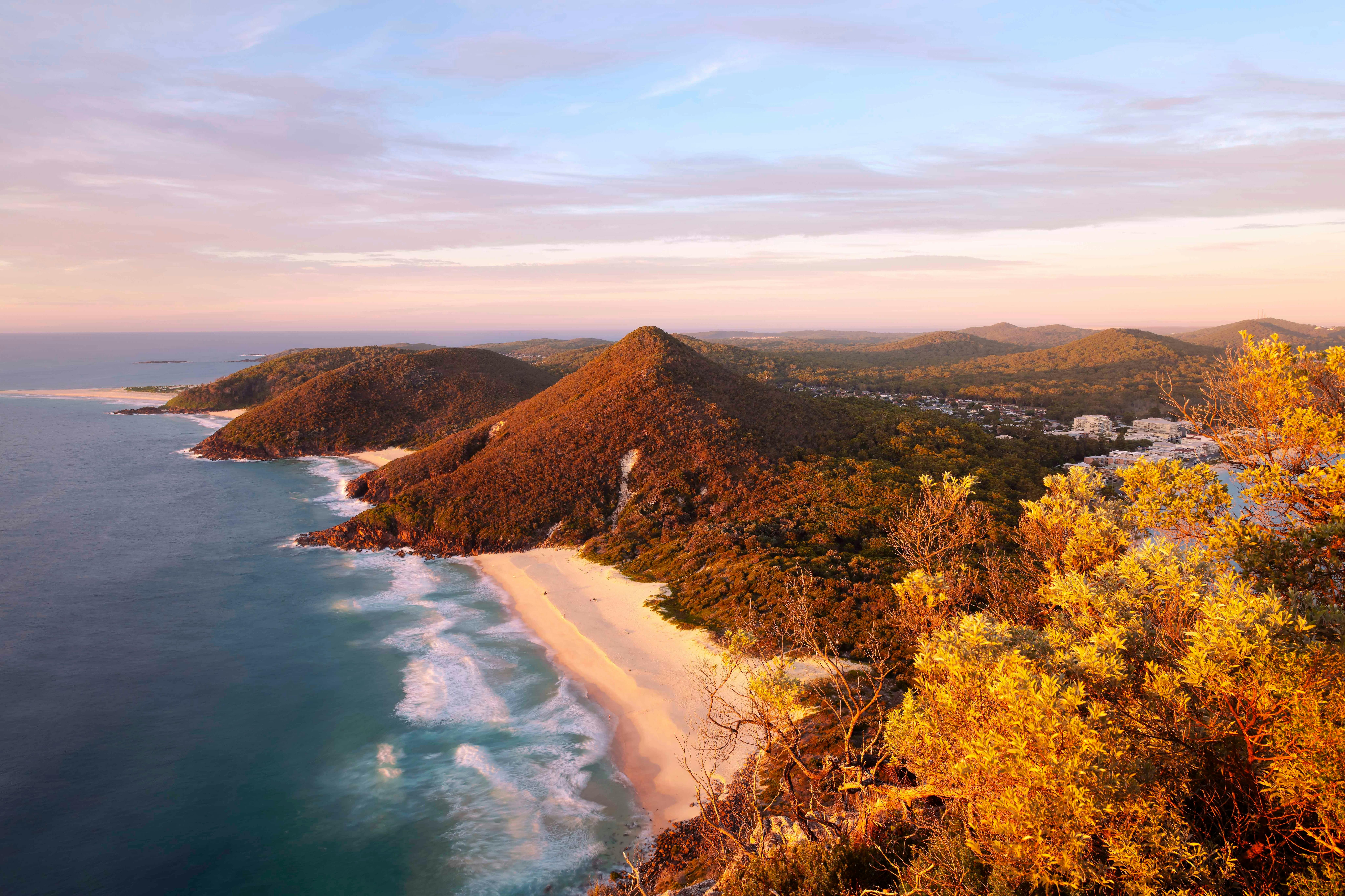 Coastal view of Port Stephens NSW with sandy beaches clear blue water and surrounding landscape
