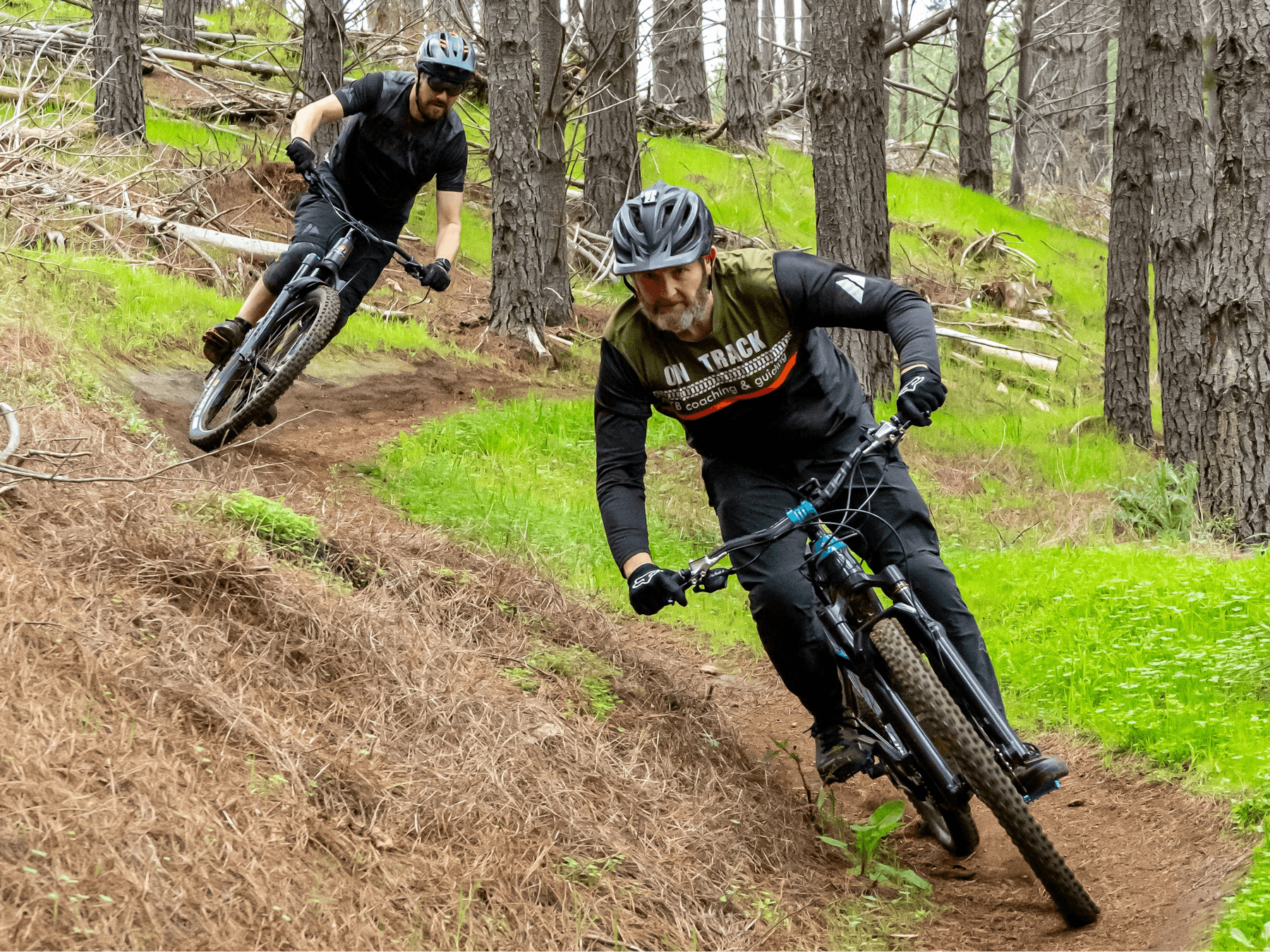 E-Bikes cornering hard on Tank to Tank trail at Nannup Tank 7 Bike Park