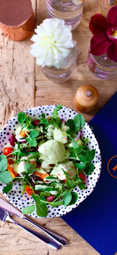 Plate of fresh food with a Pollen napkin