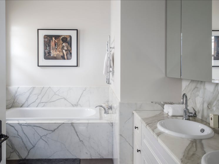 Marble bathroom with bathtub