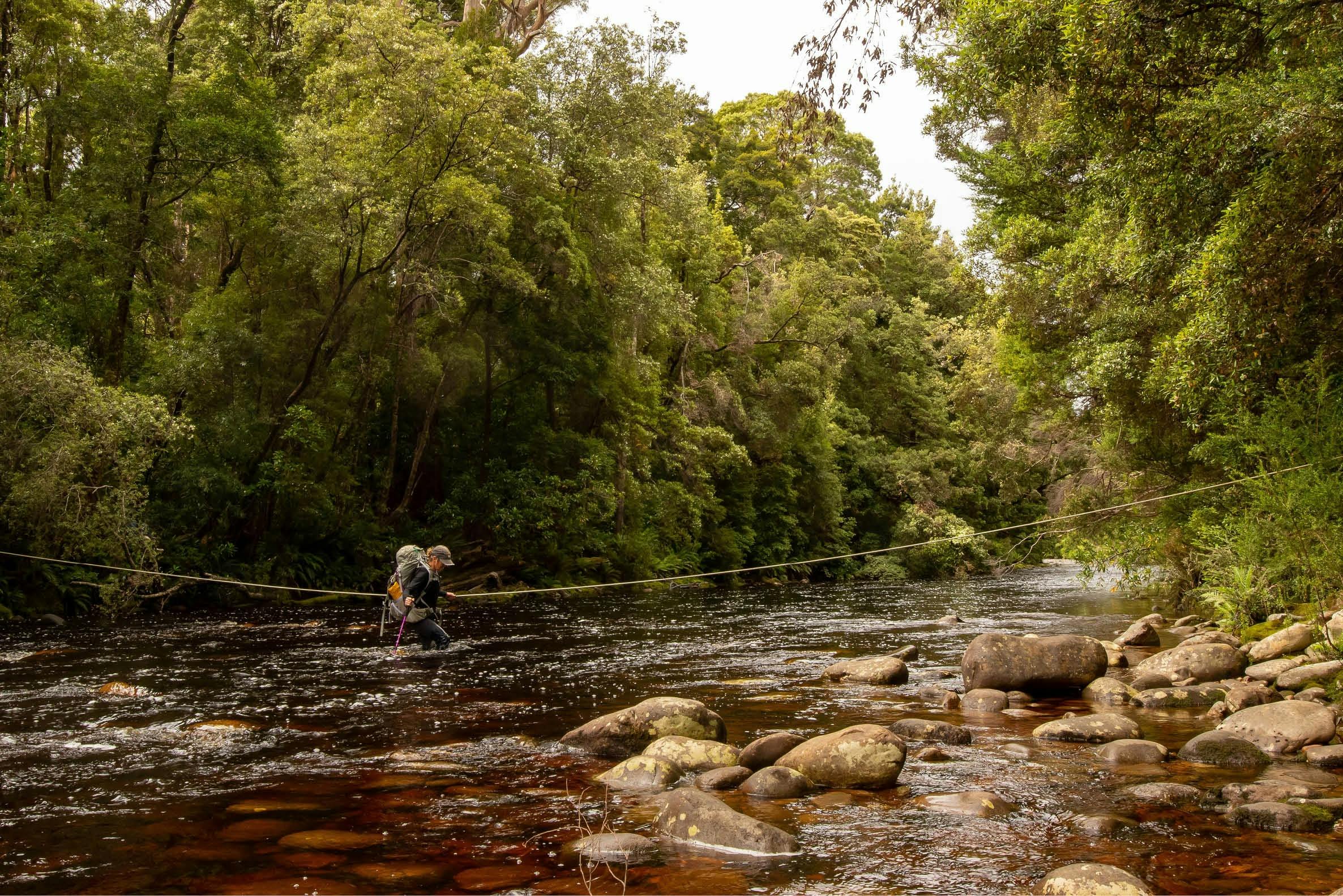 Crossing a river on the South Coast Track