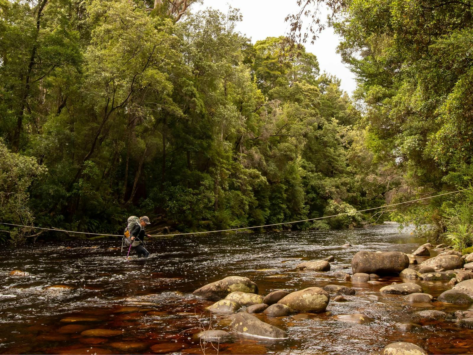 Crossing a river on the South Coast Track