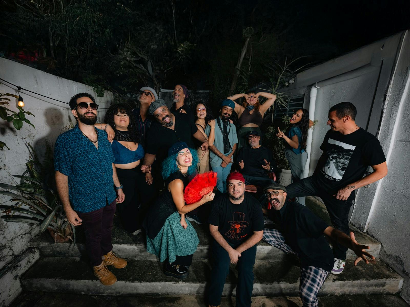 A large group of people sitting on stairs
