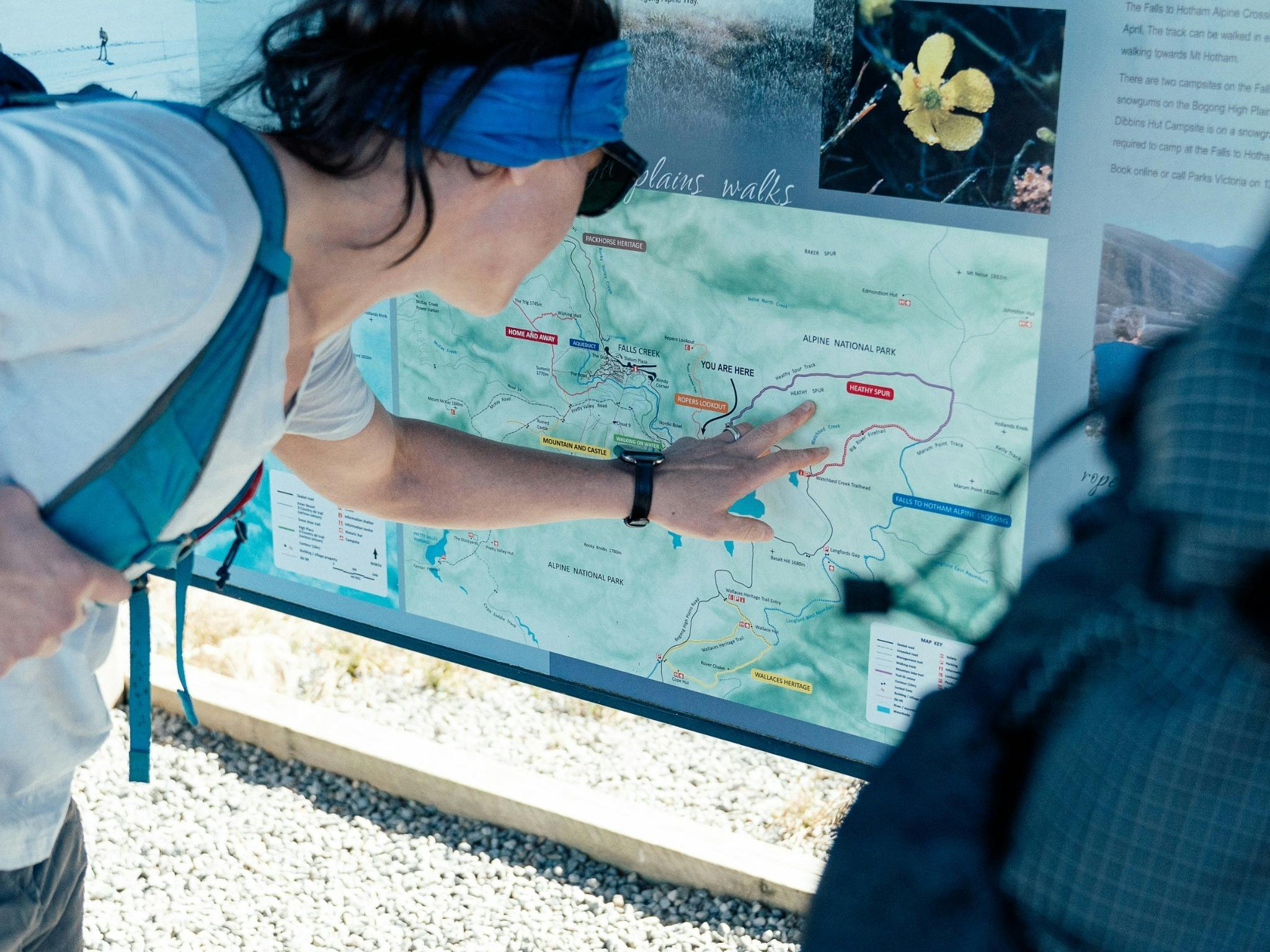 Lady reading a map for navigation on the trail