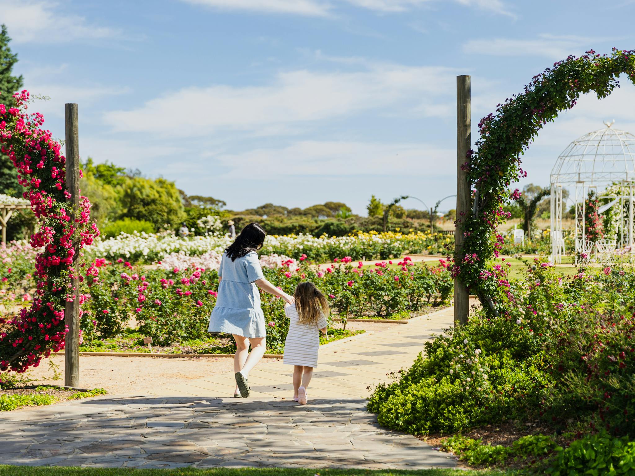 Mum and Daughter strolling through gardens