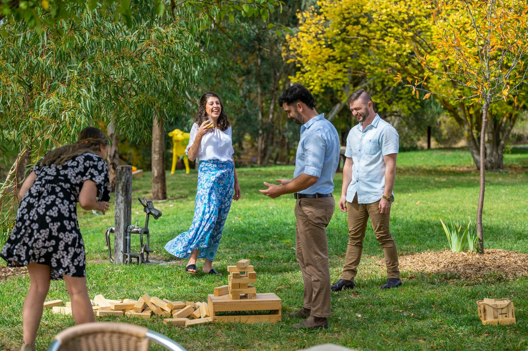 Four people in grassed area