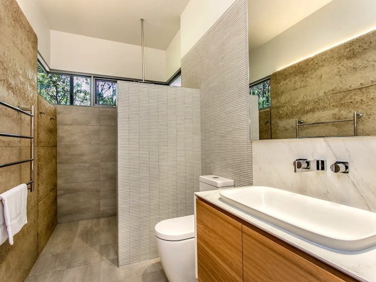 Luxurious bath featuring modern amenities and elegant design