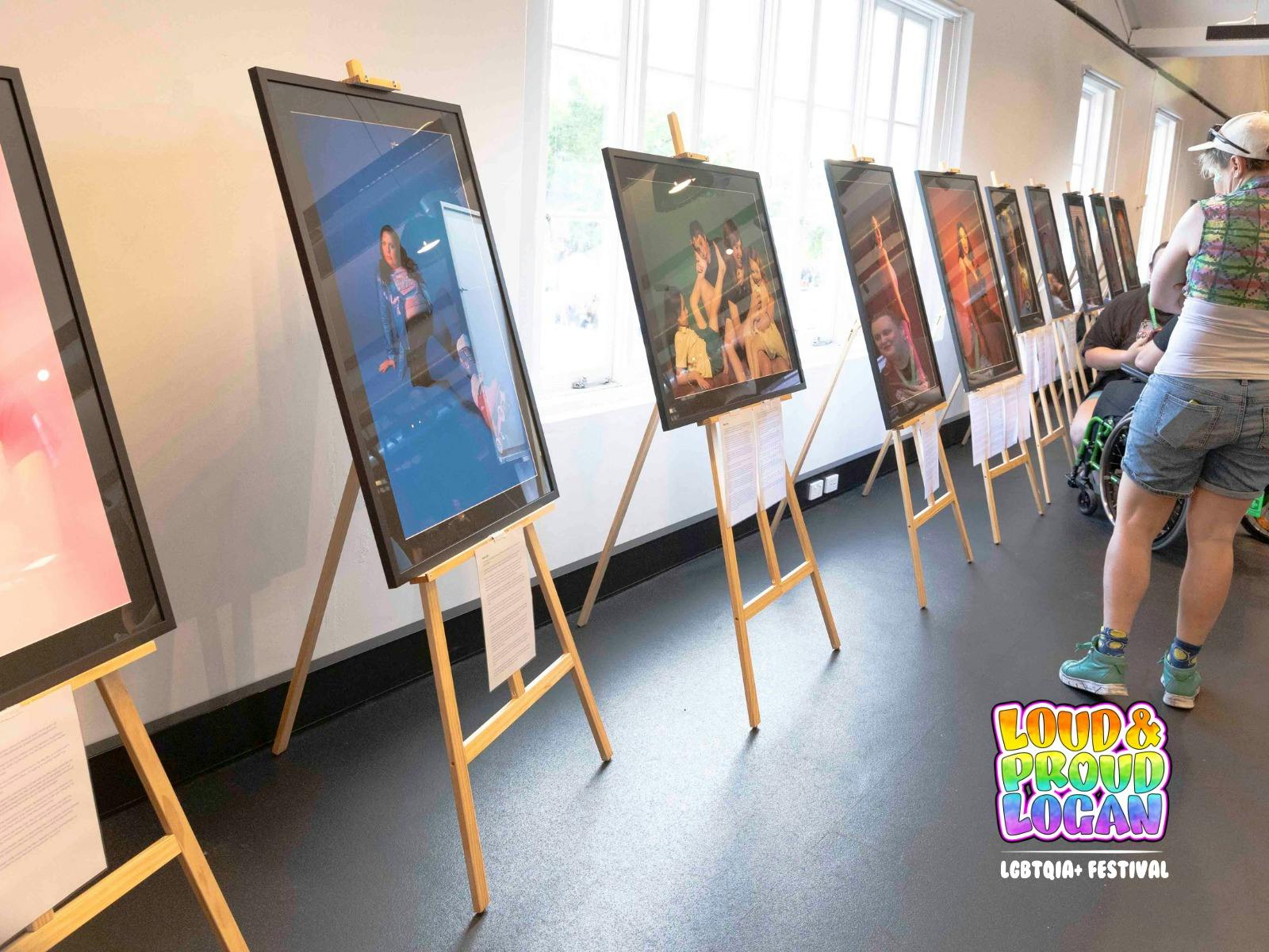 LGBTQIA+ Women's Visibility Exhibition portraits on display at Loud and Proud Logan