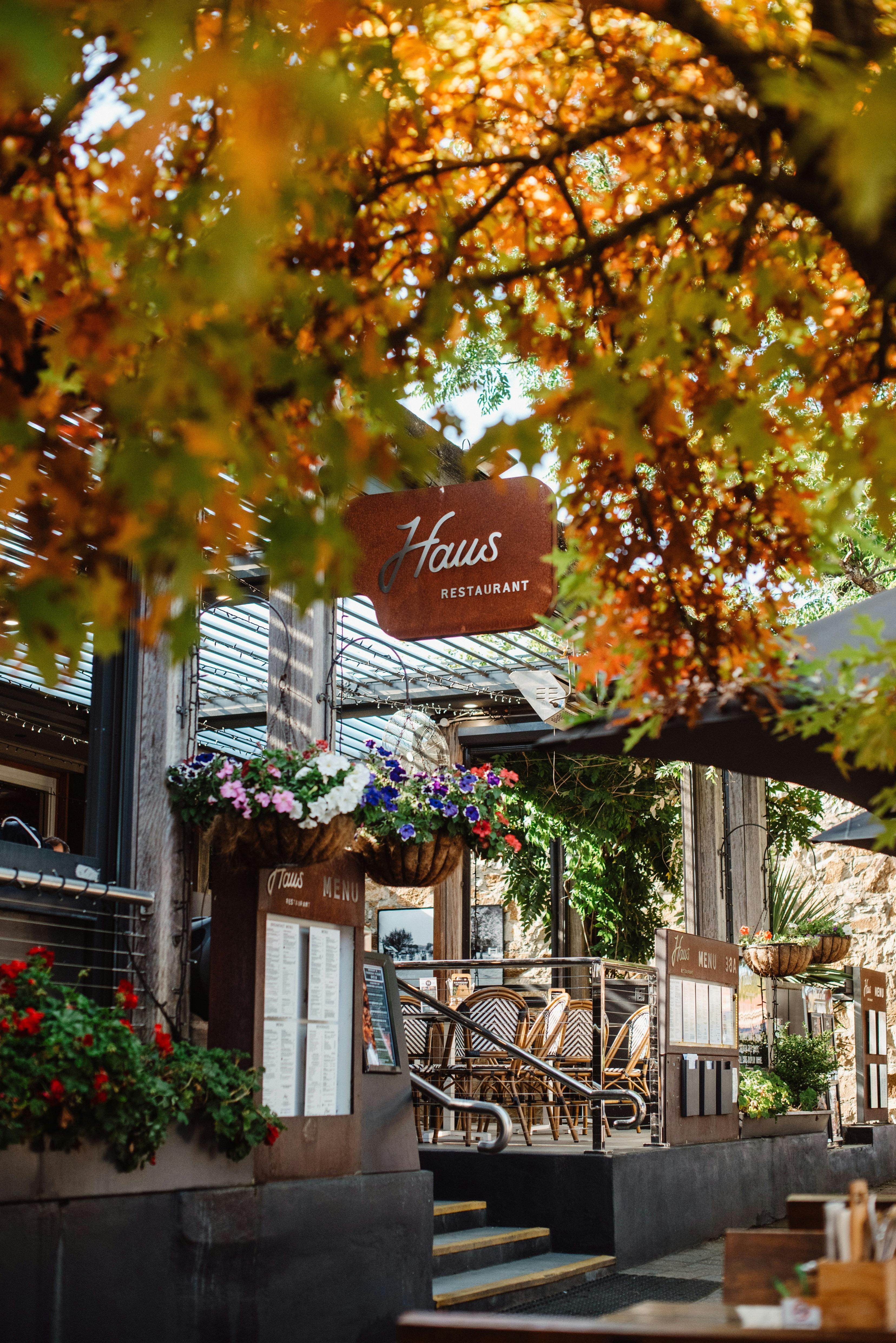 Rustic sign for The Haus Restaurant on an Autumn Day in Hahndorf