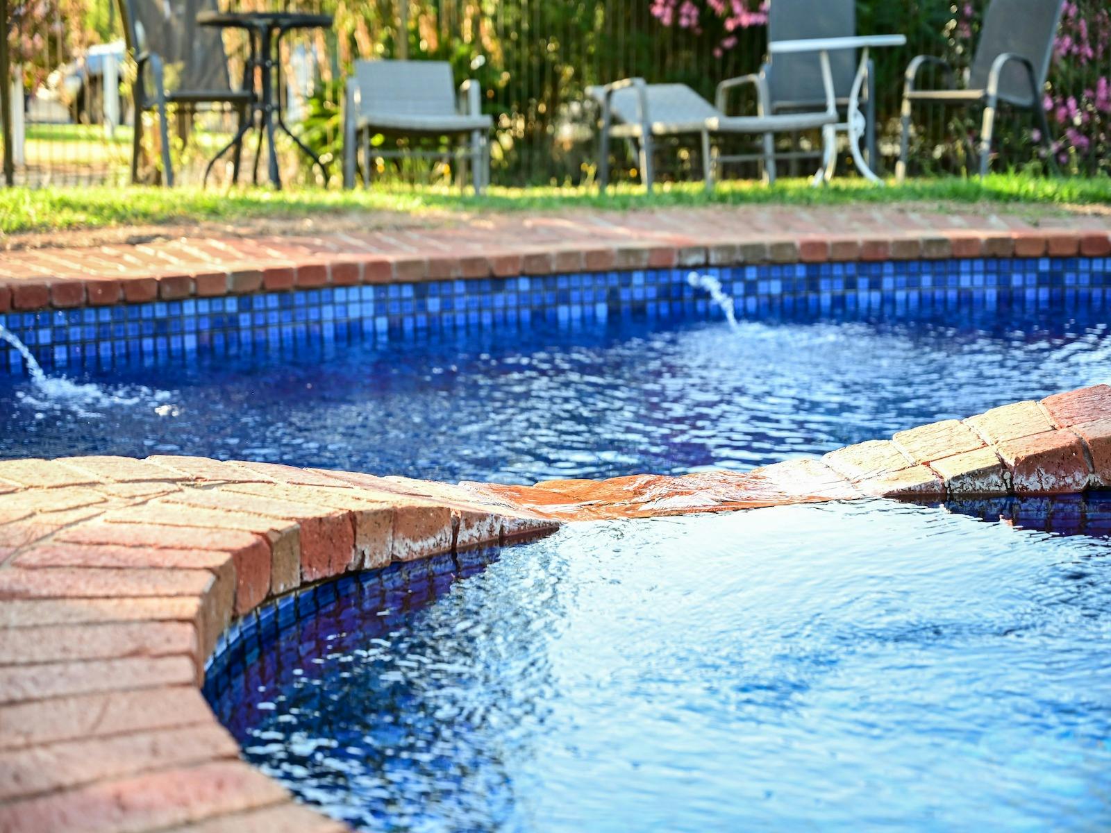 Swimming Pools, brick surrounding the blue water