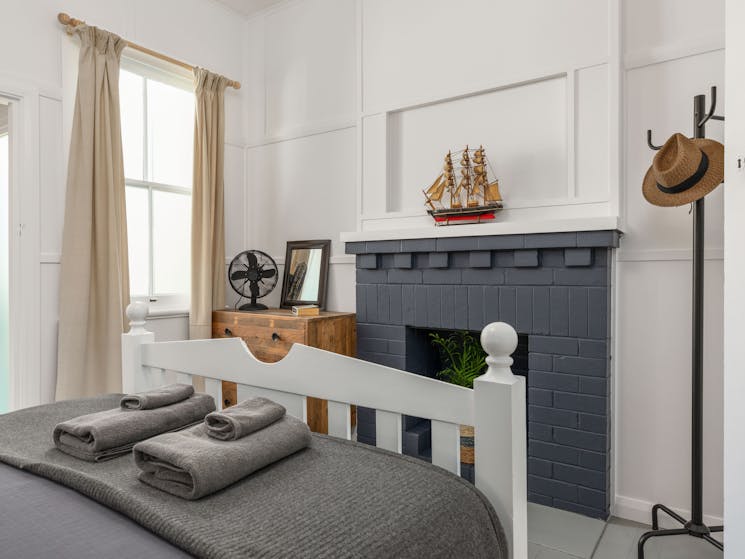 Bedroom, grey and white, with open fire place (not in use)