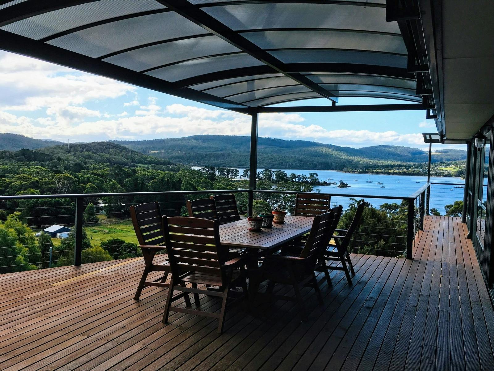 Large outdoor deck with outdoor seating and amazing views