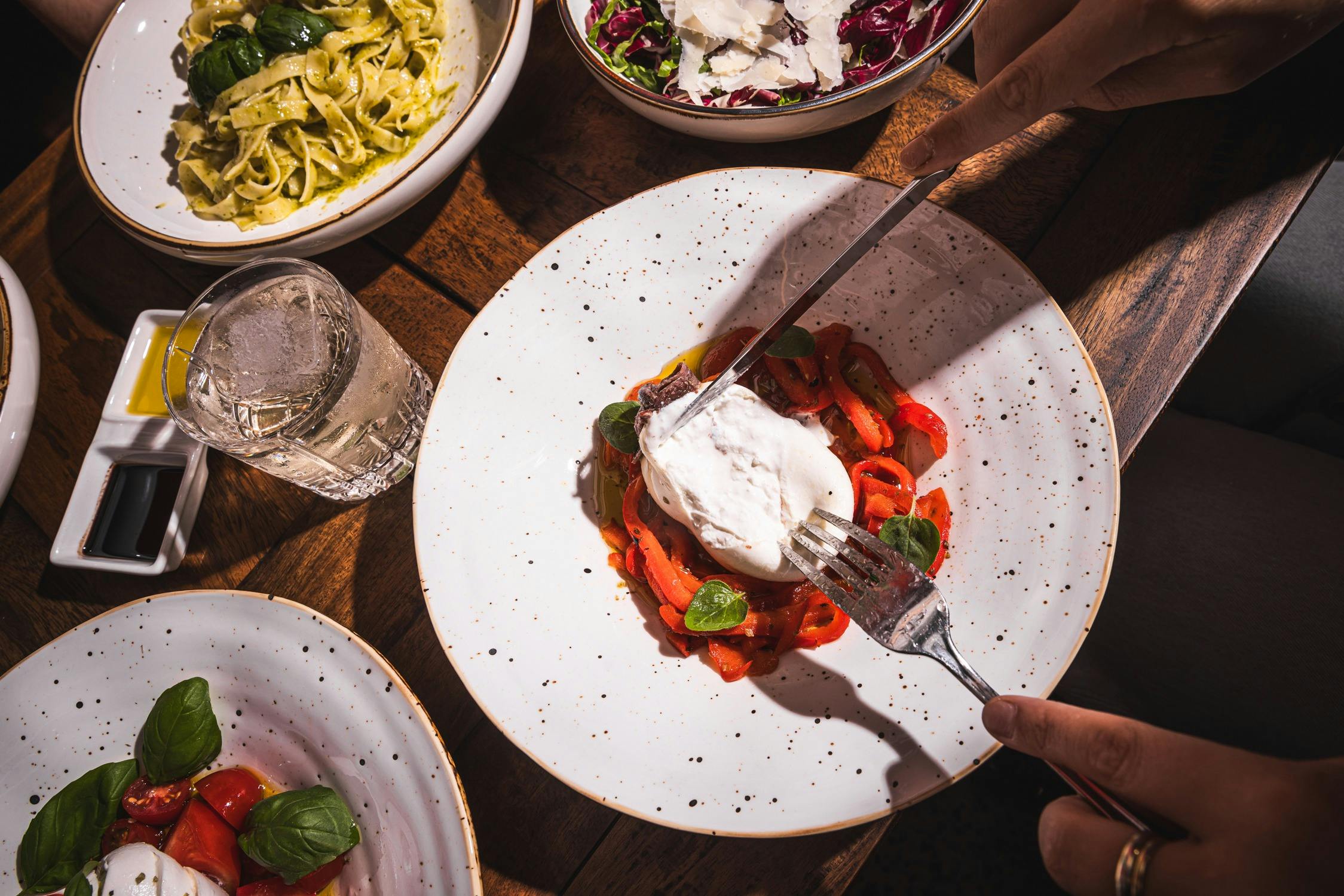 Fork pulling apart Burrata
