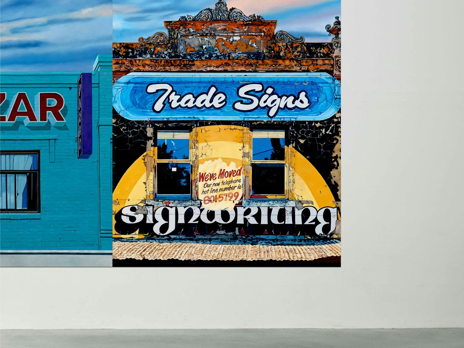 Trade Signs storefront painting with bold vintage lettering by Donovan Christie.