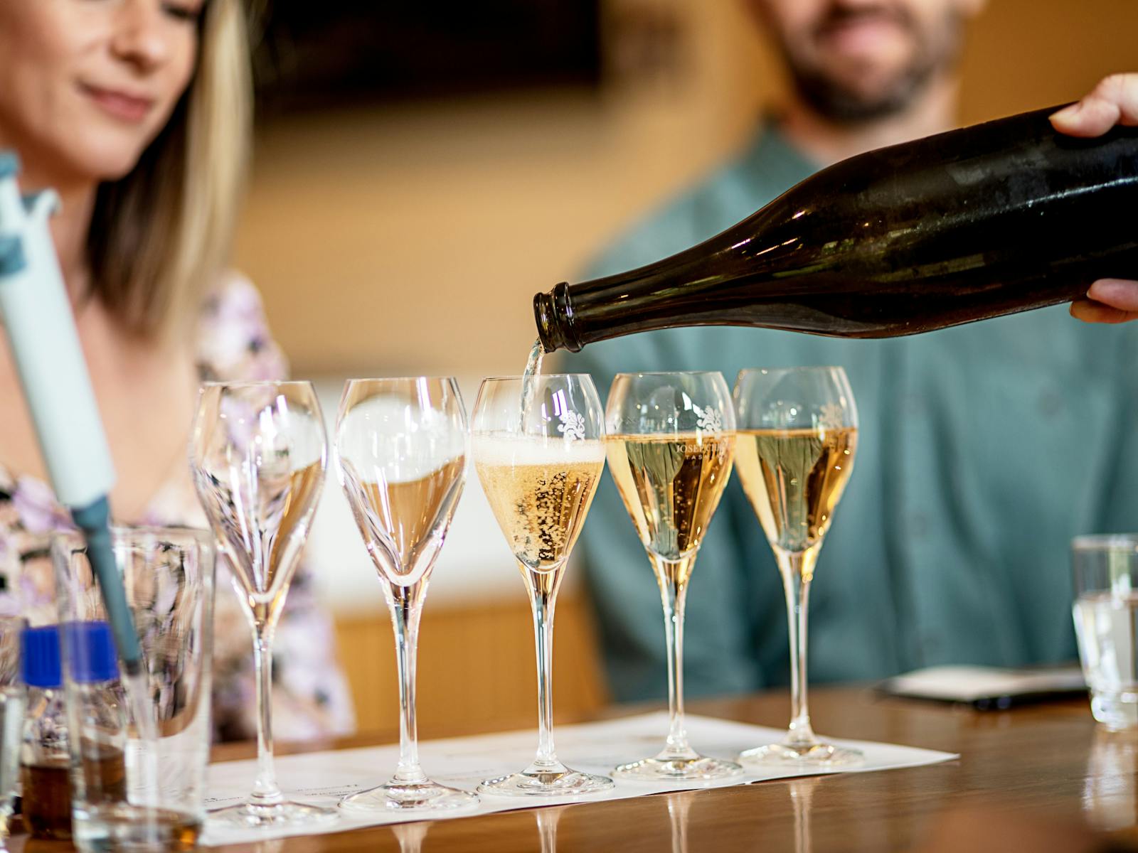 4 glasses of sparkling wine being poured for Josef Chromy Wines'  the Art of Sparkling experience,
