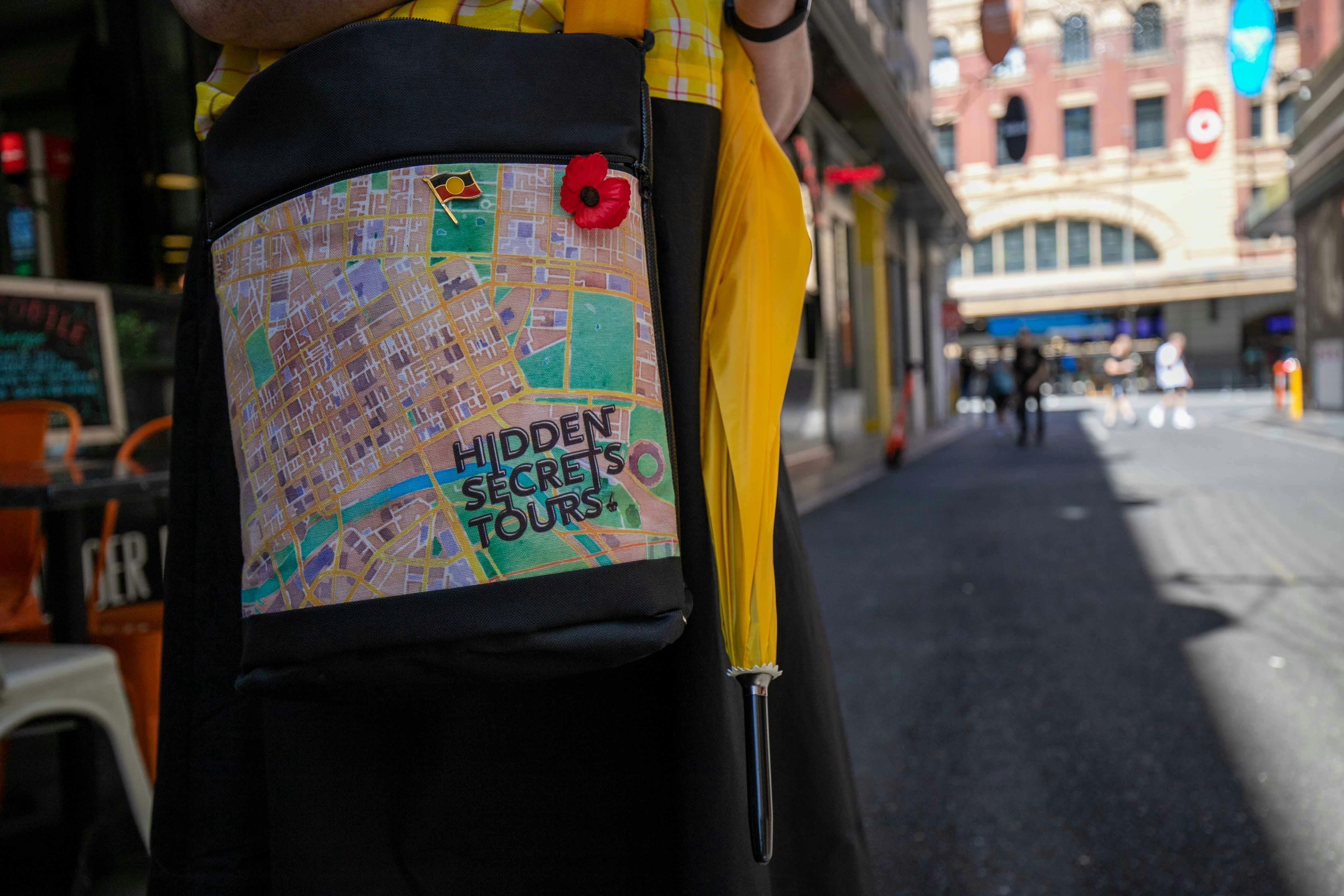 Our guides are easily recognizable with a distinct bag and yellow umbrella