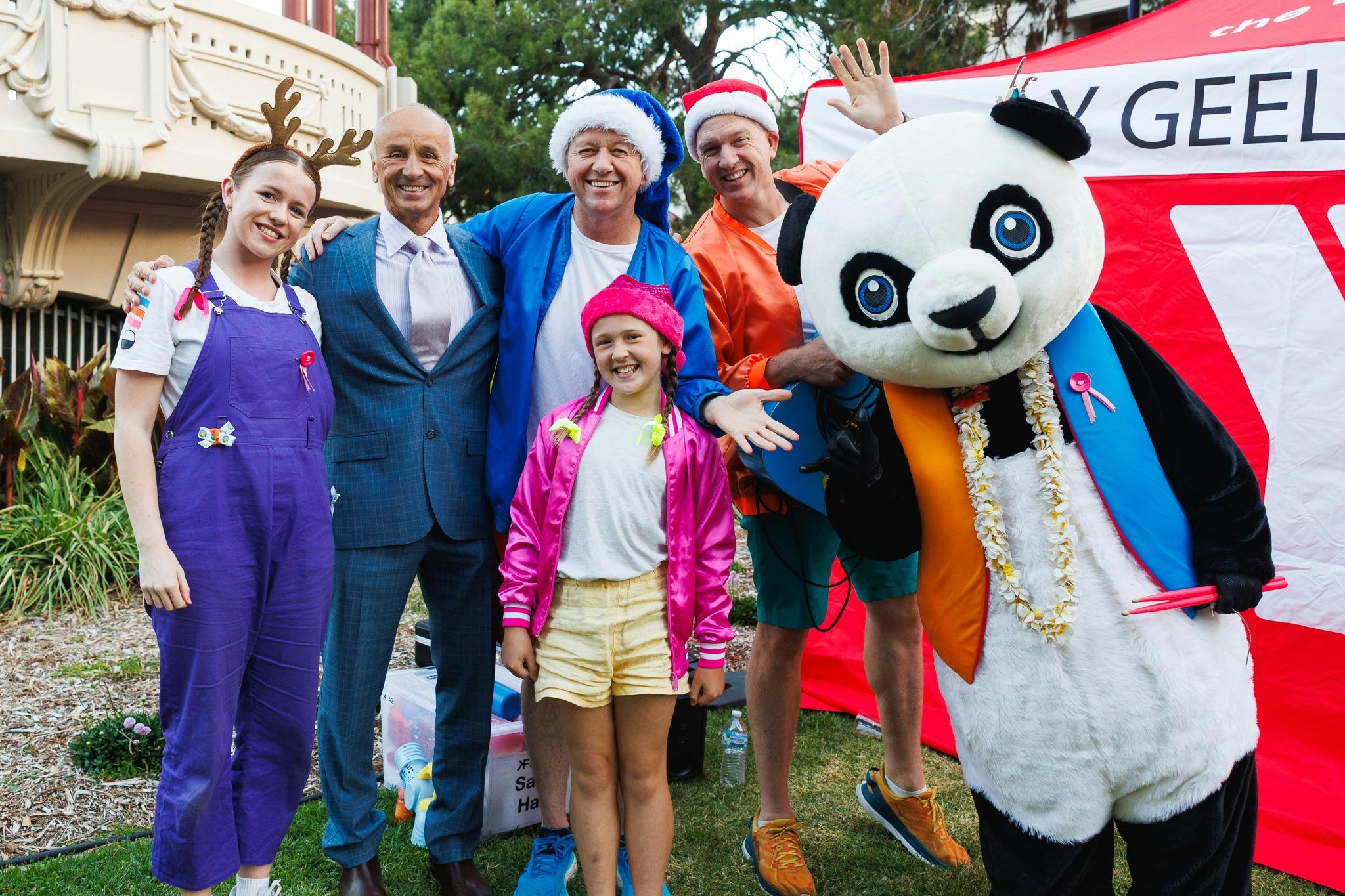 Artists and Mayor standing in from of the artists tent at Johnstone Park Geelong