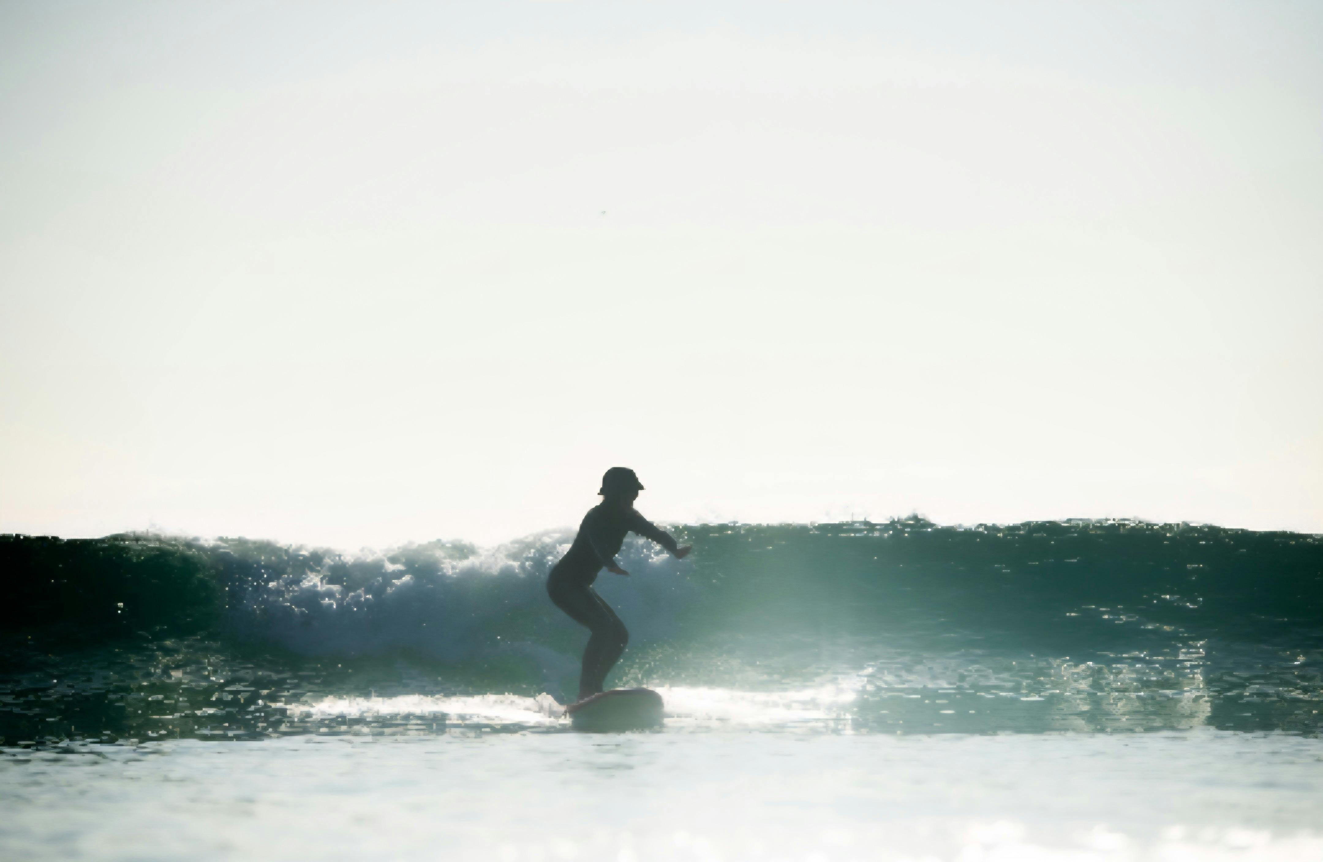 Surfing student catching a wave