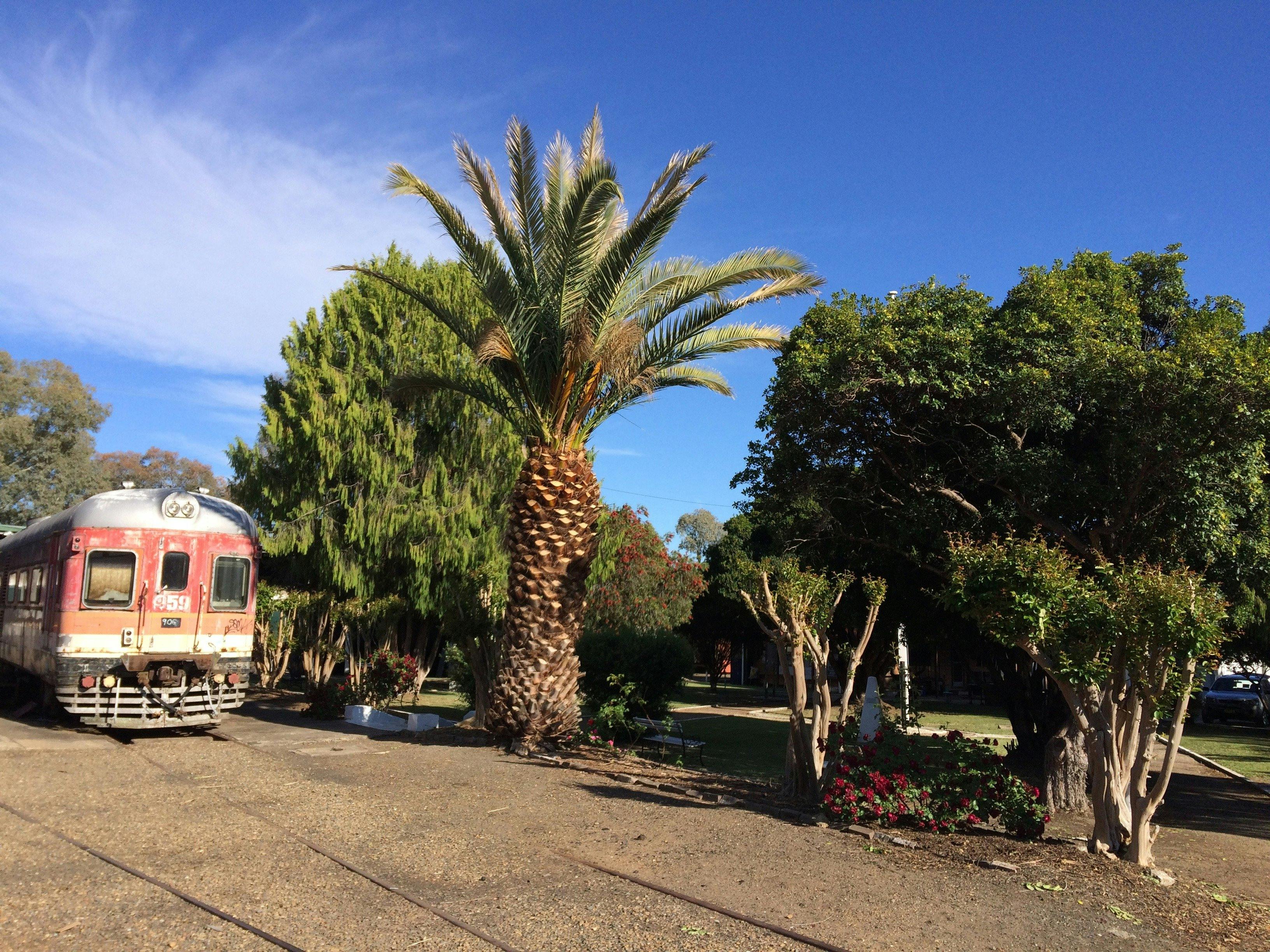 Diesel rail car next to the Depot  Garden and War Memorial