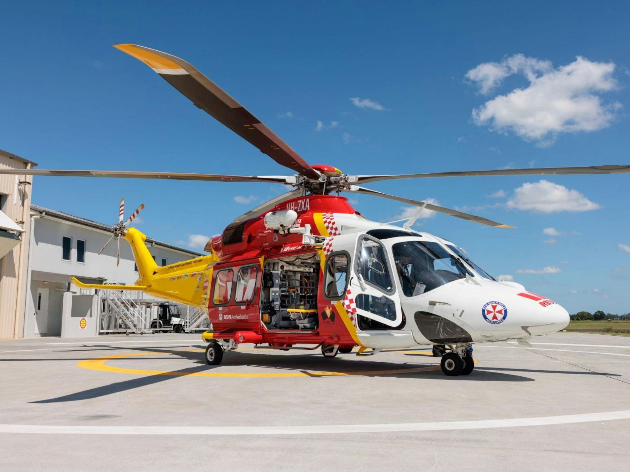Image of a Westpac helicopter grounded on the tarmac