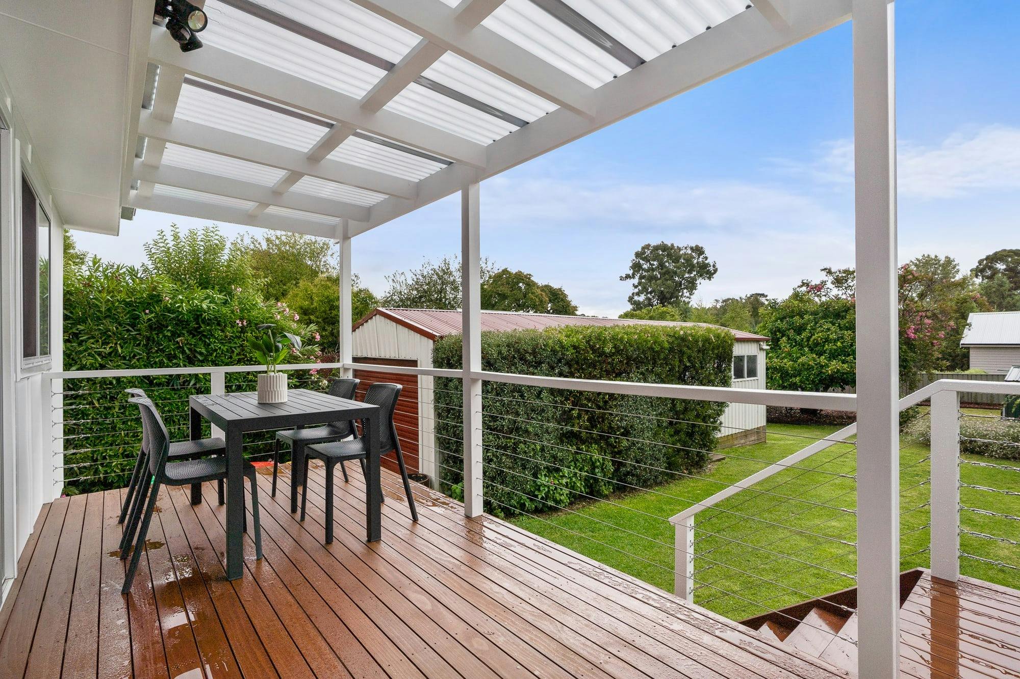 Deck with outdoor dining table and chairs