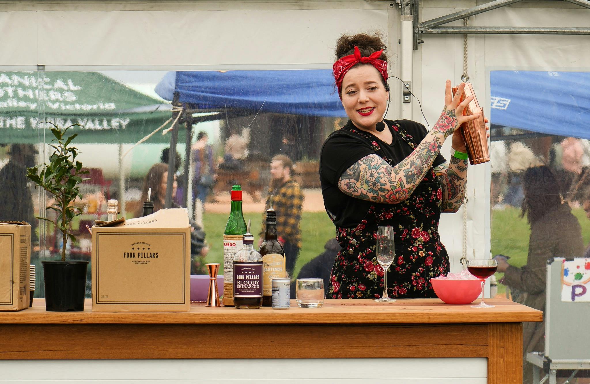 Woman shakes a cocktail at CherryHill Orchards Bloom and Graze live workshop