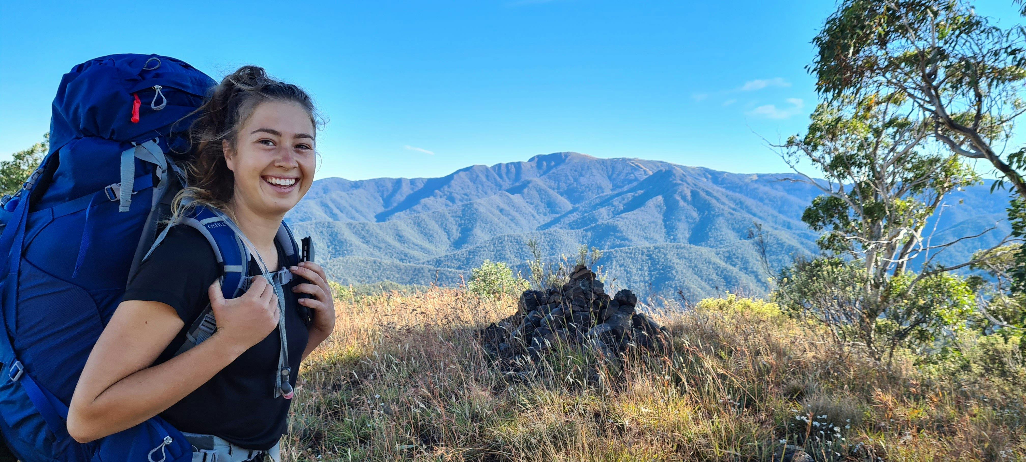A hiker enjoying a magnificent view of Mt Buller.