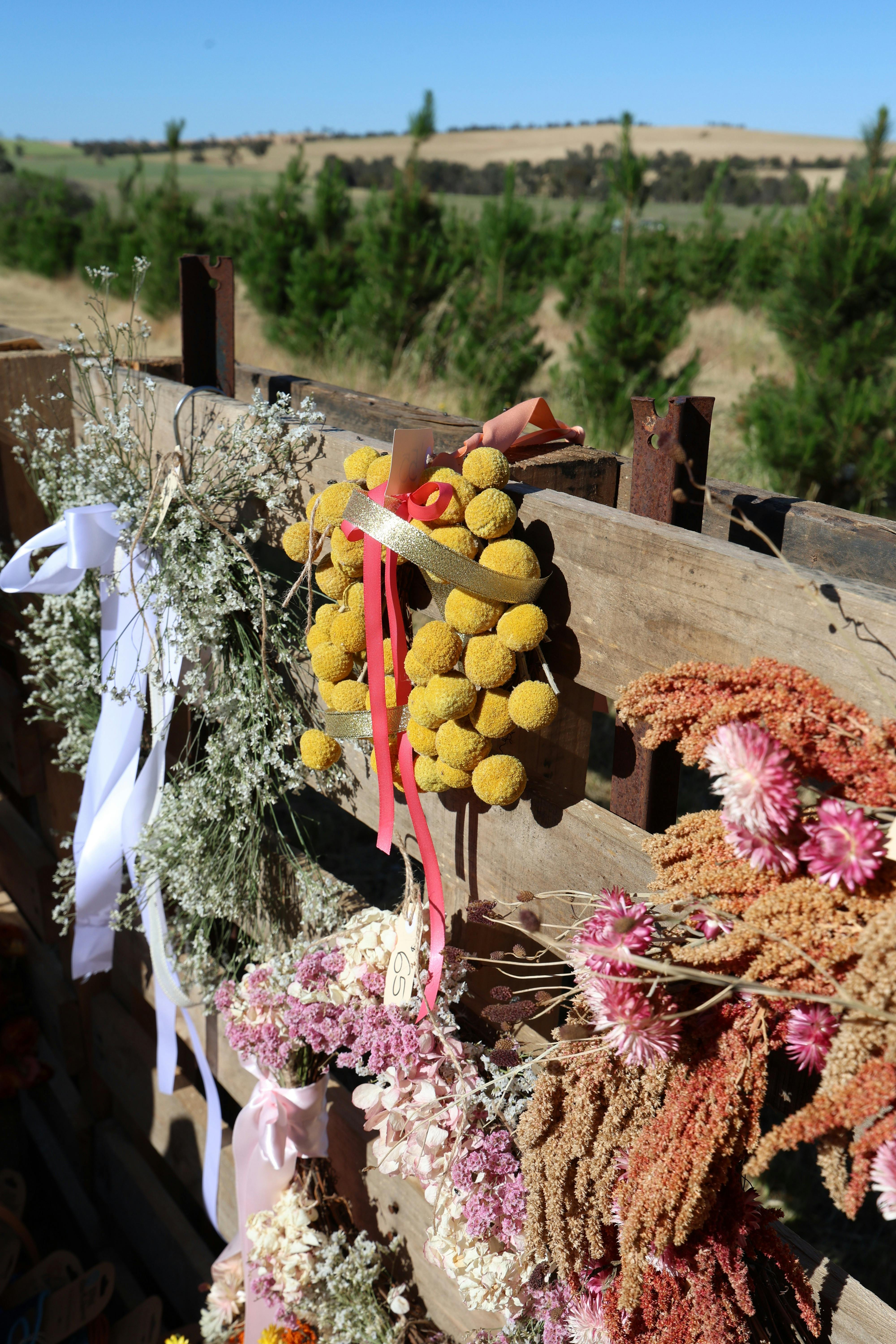 Christmas wreathes made with a variety of dried flowers