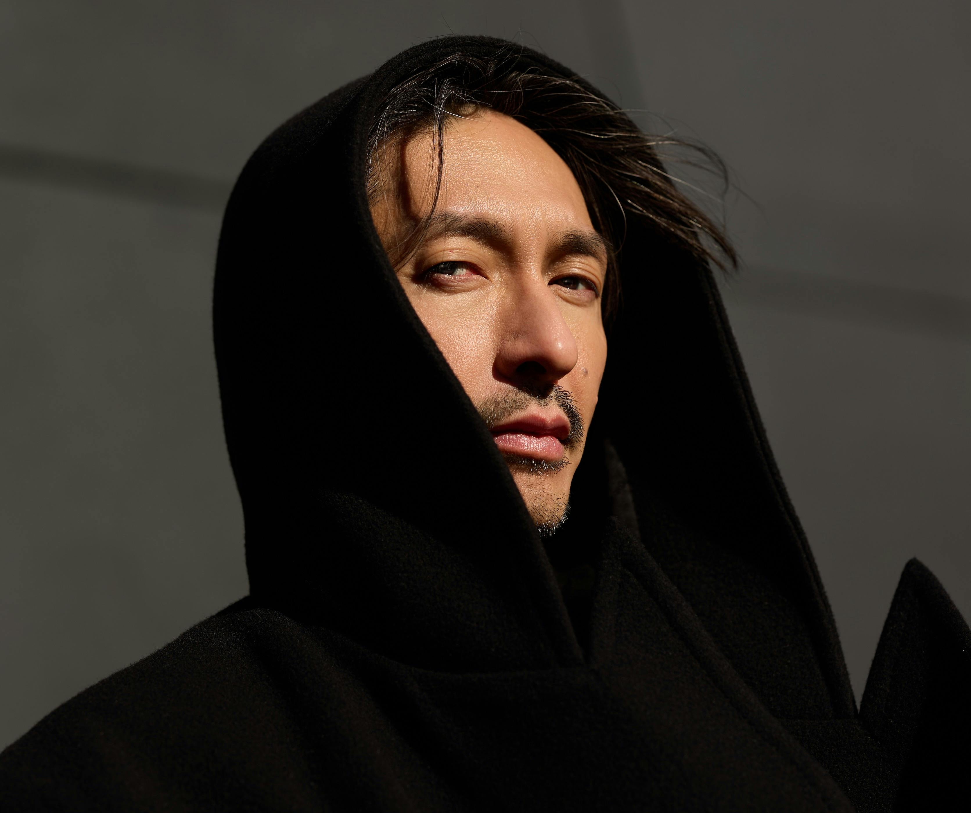 BIGYUKI headshot - wearing a black hooded top
