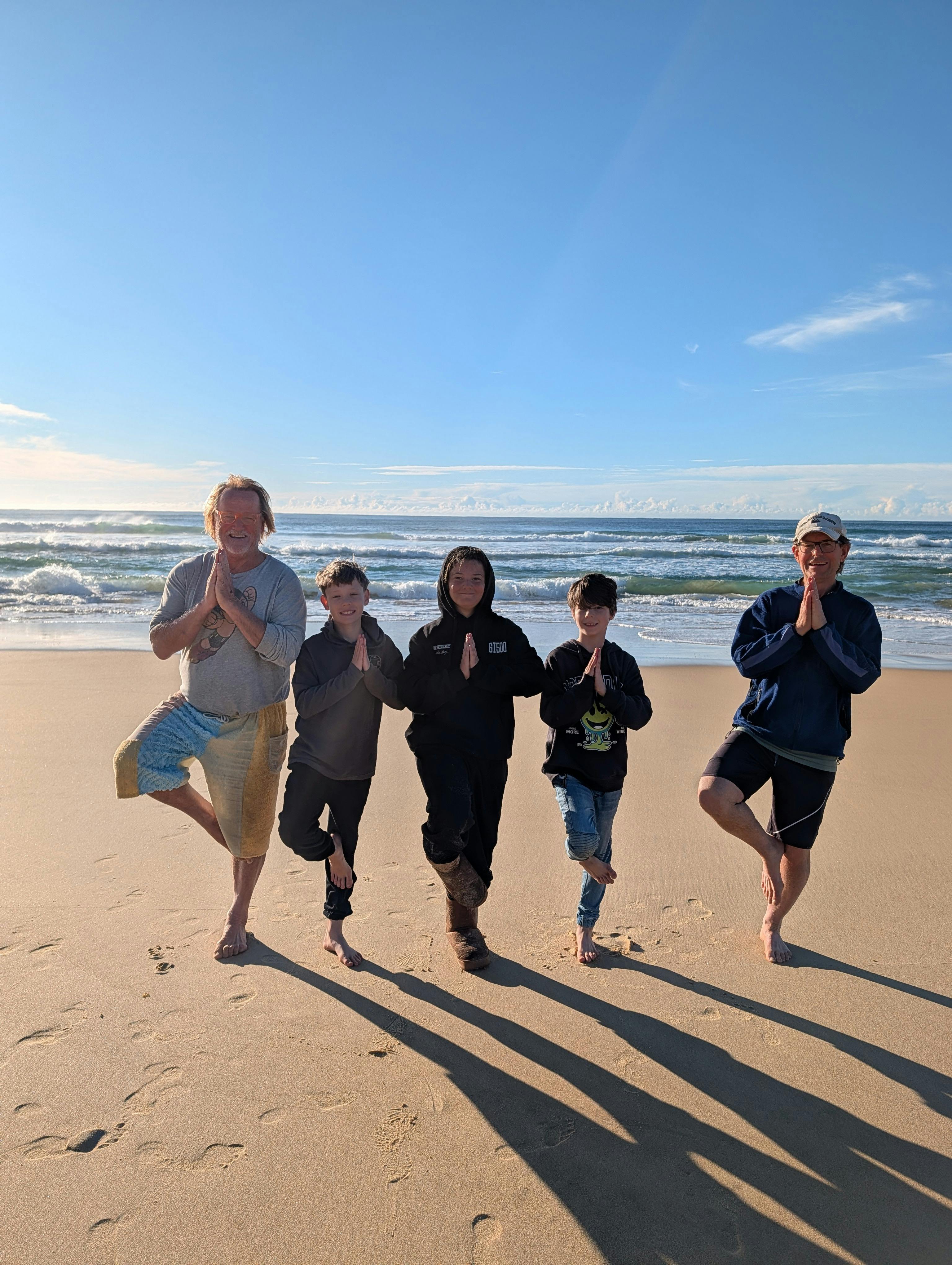 Finding balance at a morning barefoot beach yoga session at Potato Point, Eurobodalla coast NSW.