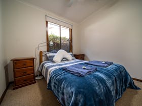 Features a double bed with high quality manchester, bedside tables, reading lamps and a ceiling fan