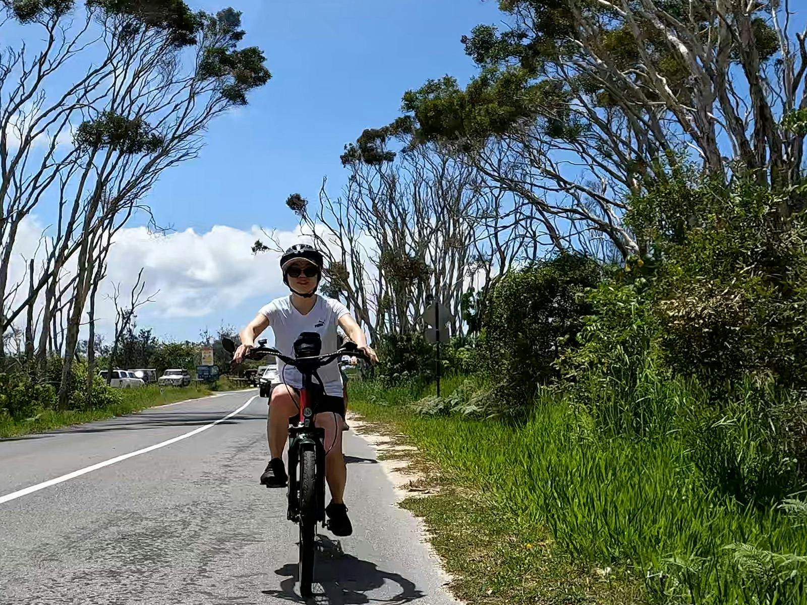 Smiling riders enjoy the Noosa North Shore Tour, biking peaceful roads along Noosa River’s north sid Smiling riders enjoy the Noosa North Shore Tour, biking peaceful roads along Noosa River’s north sid