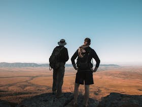Two people stopping to take in the view of Wilpena Pound