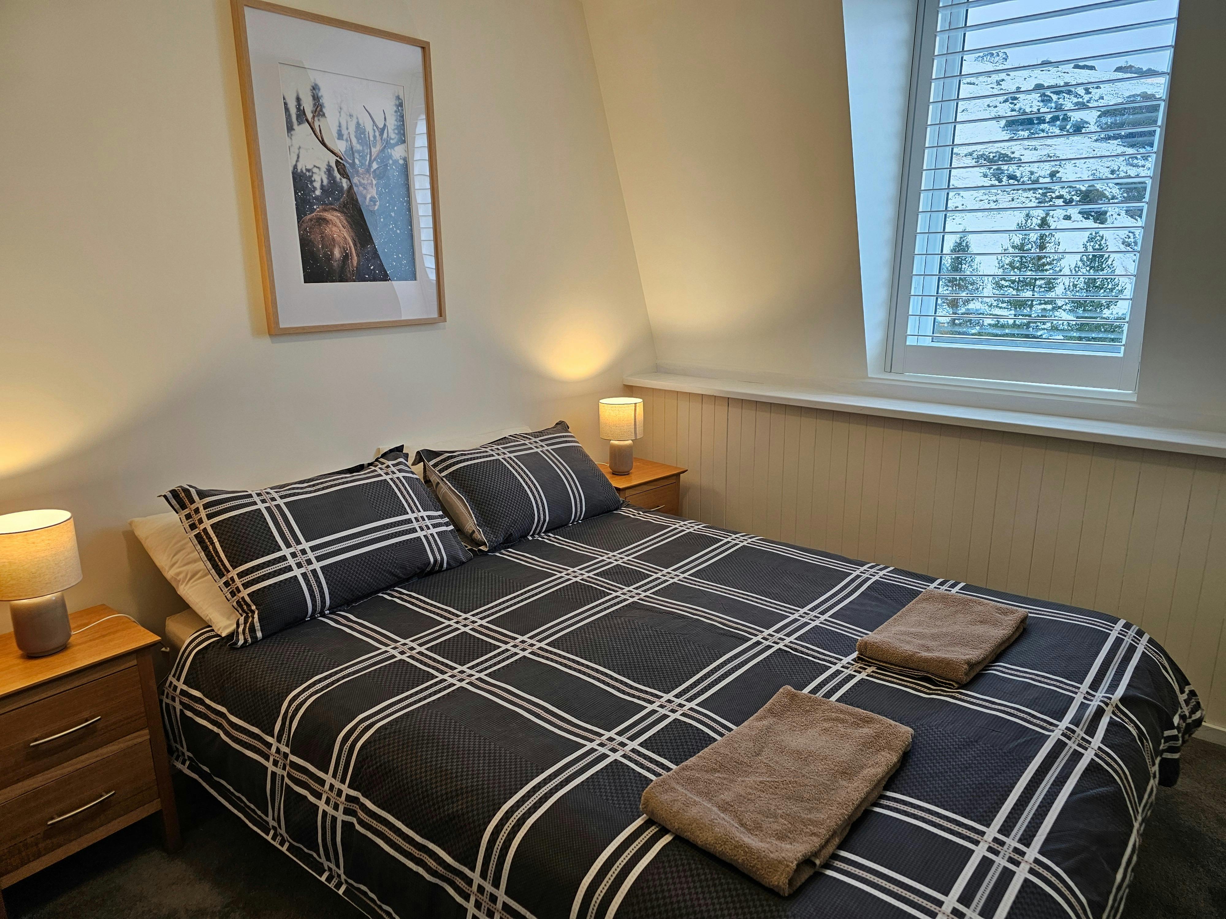 Bedroom with bedside tables and lamps