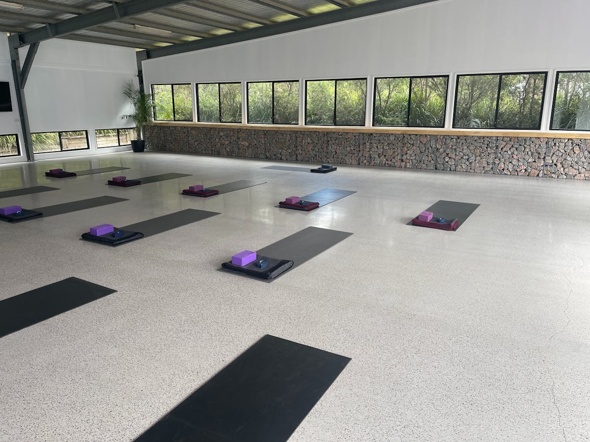 Inside the Trainign Centre with yoga mats and blosters ready for a yoga class