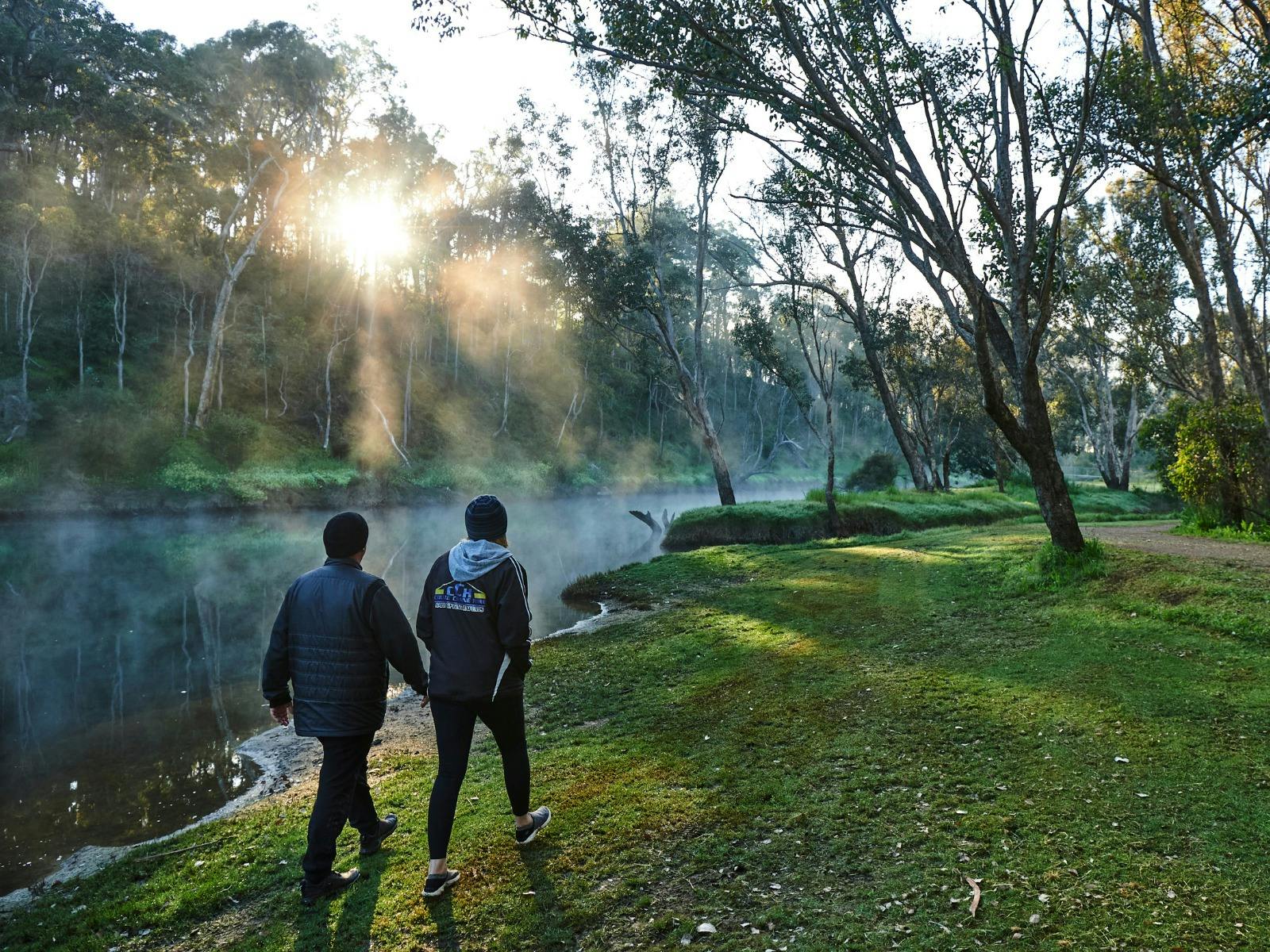 2 people walking along the Blackwood River