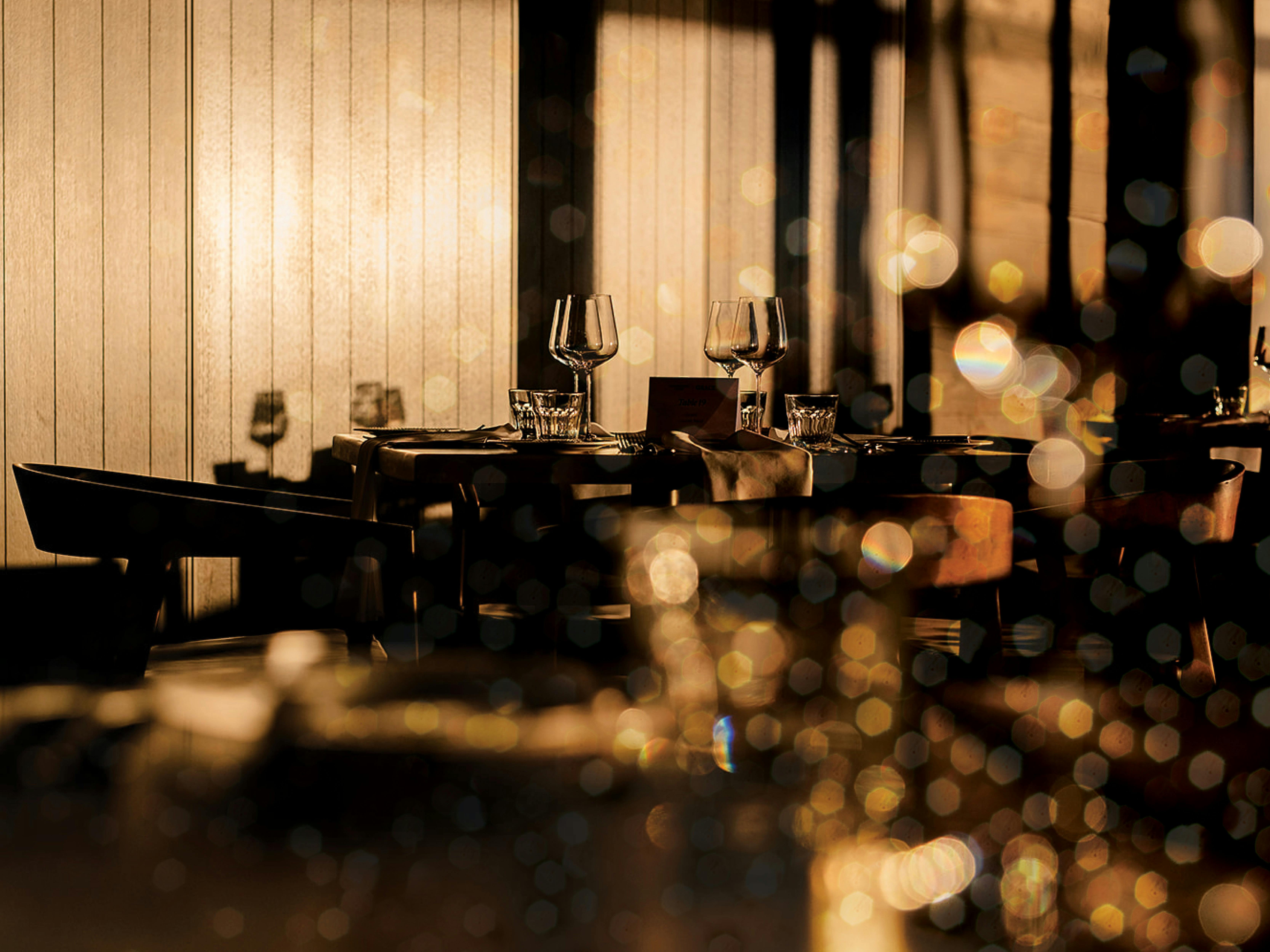 Wine glasses sparkling on Christmas themed table