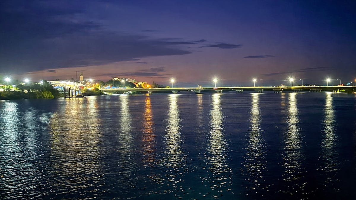 Image of Pioneer River reflecting beautiful lights at dusk