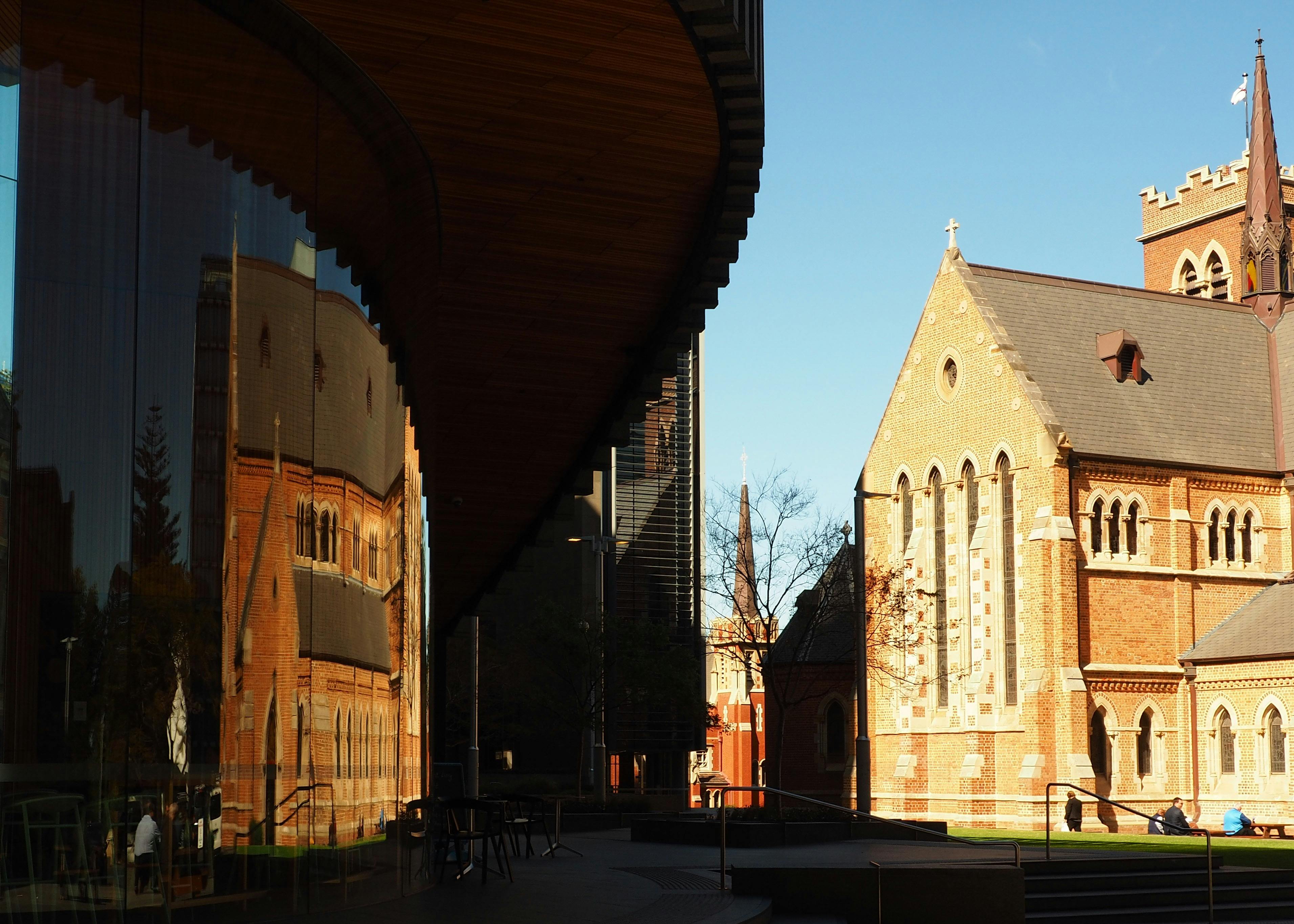 Old church reflected in modern window