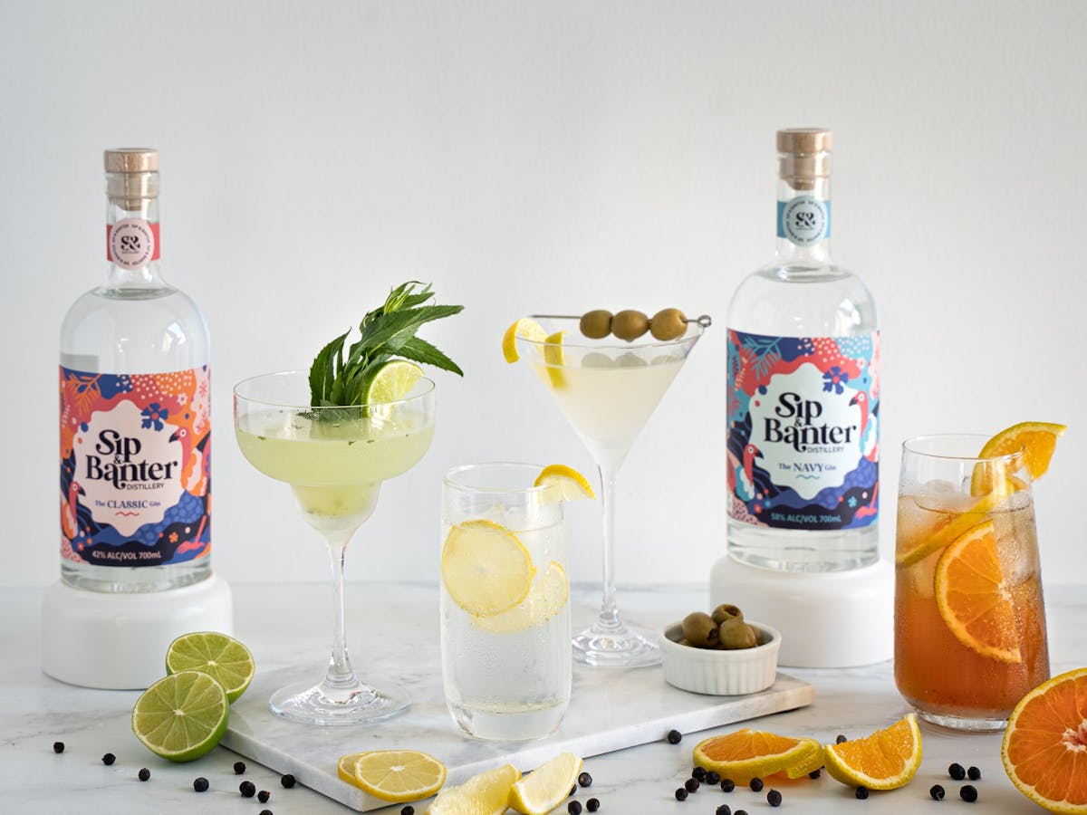 Various gin-based drinks and bottles of Gin
