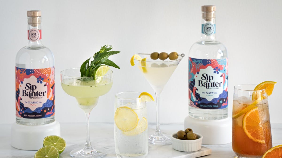 Various gin-based drinks and bottles of Gin