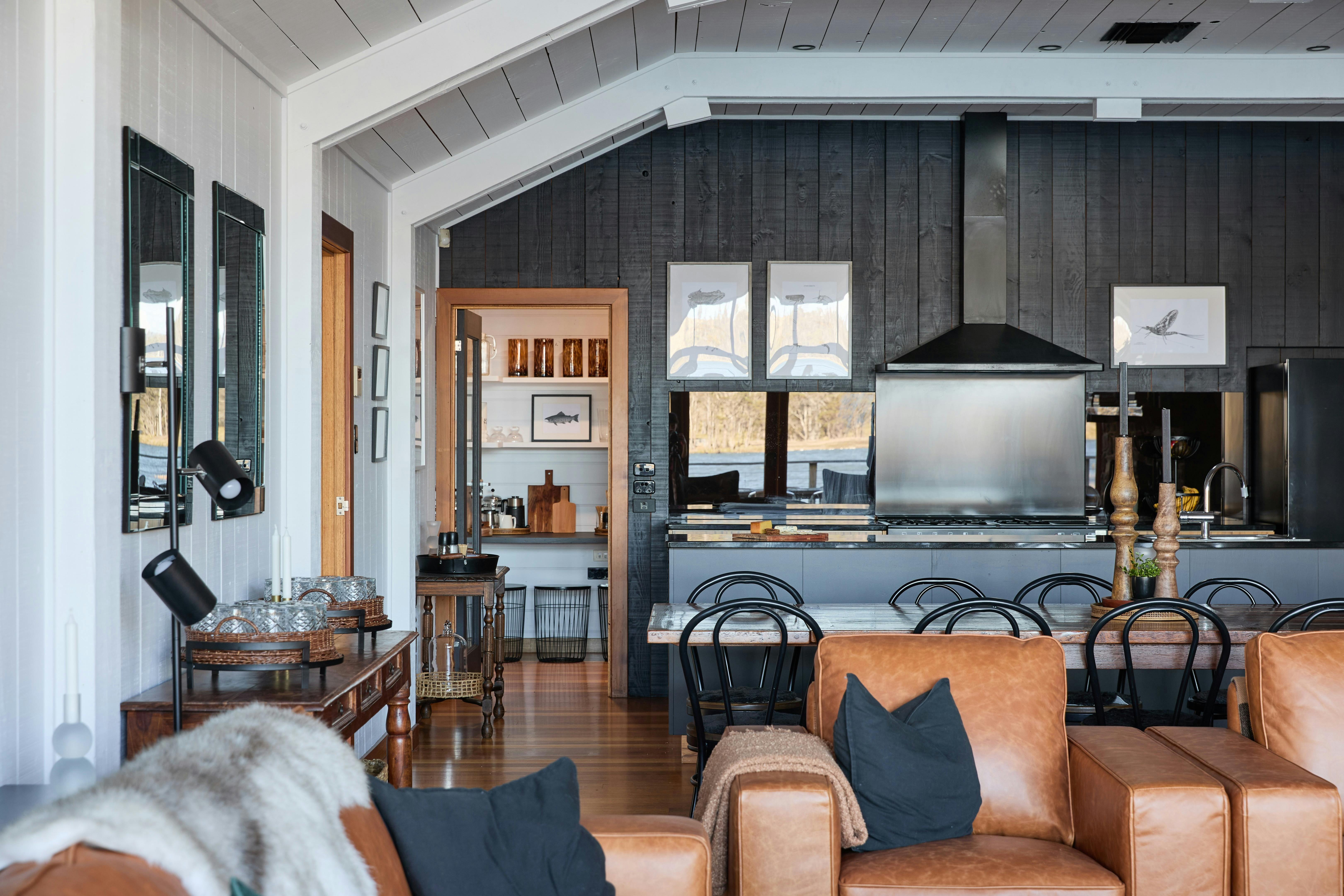 Open plan kitchen, living and dining with warm earthy tones