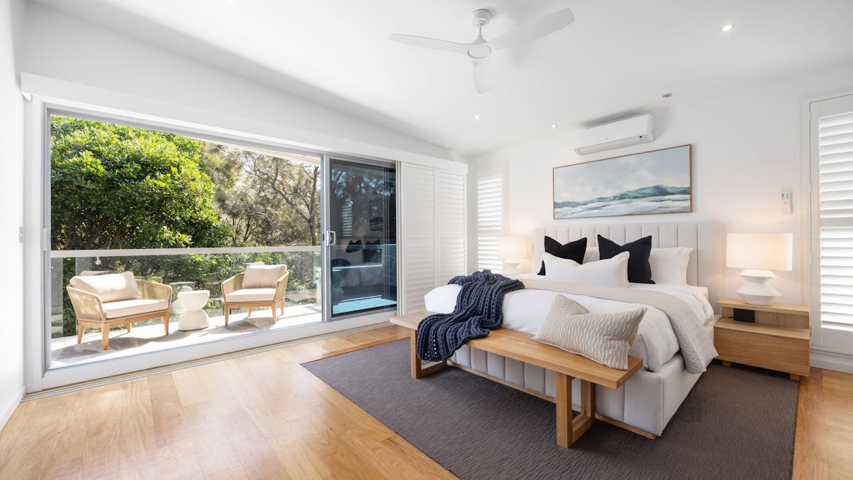 Master bedroom with king bed, private balcony, walk in robe and ensuite.