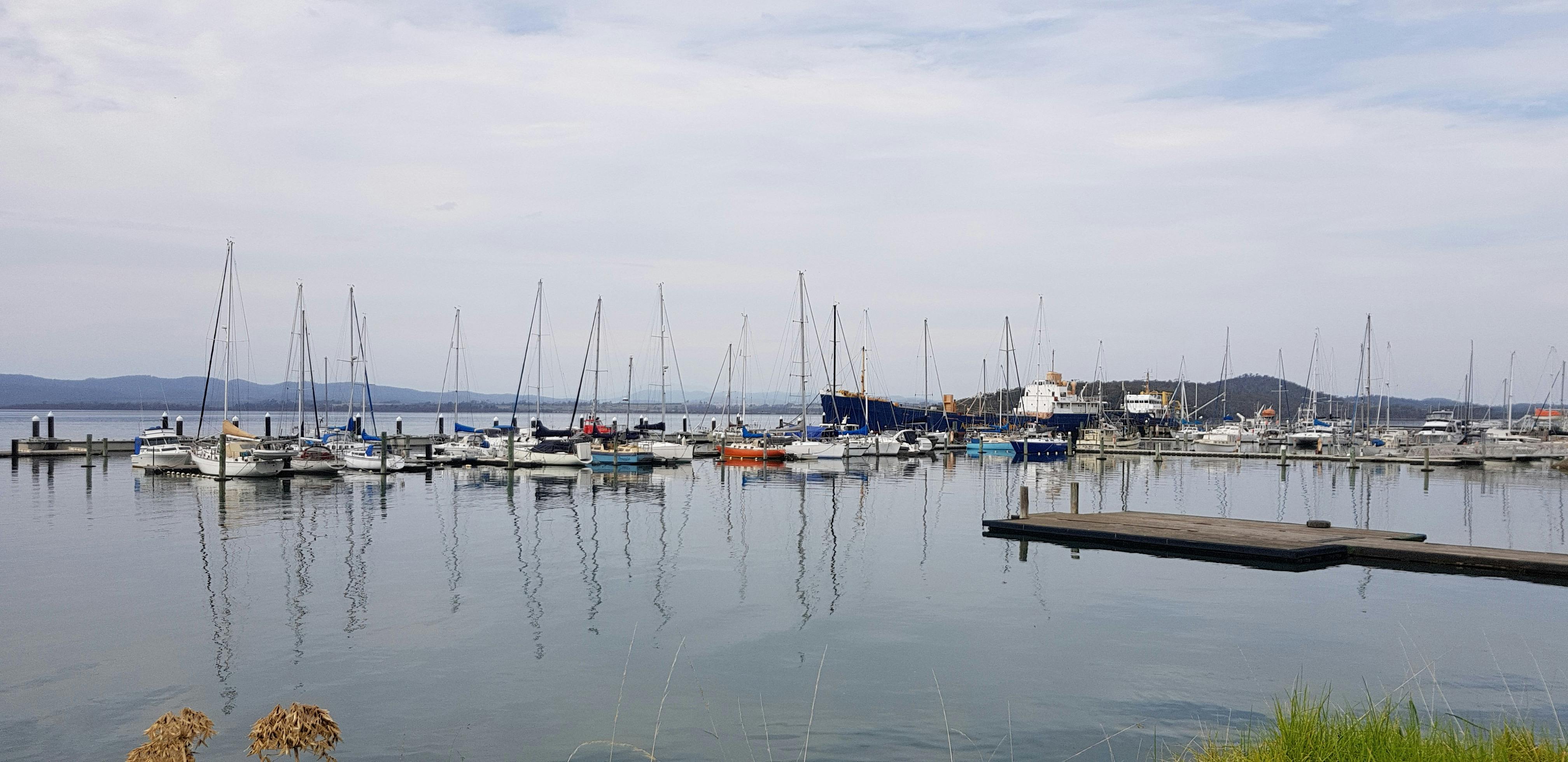 Boats on the still glassy water at Beauty Point Marina