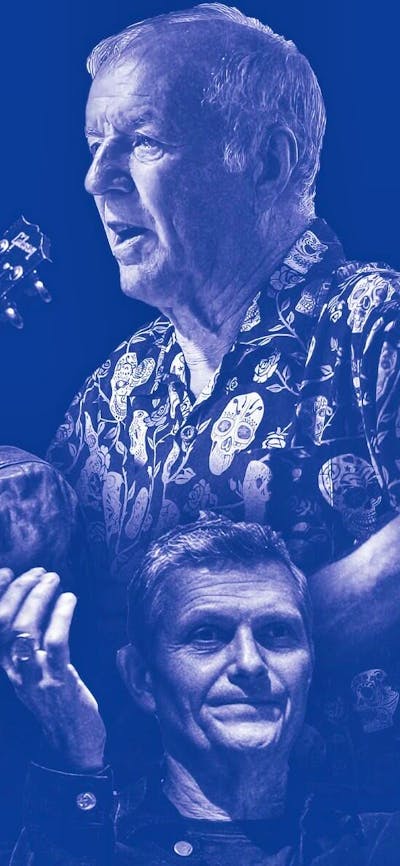 Four men with instruments stand in front of a blue backdrop