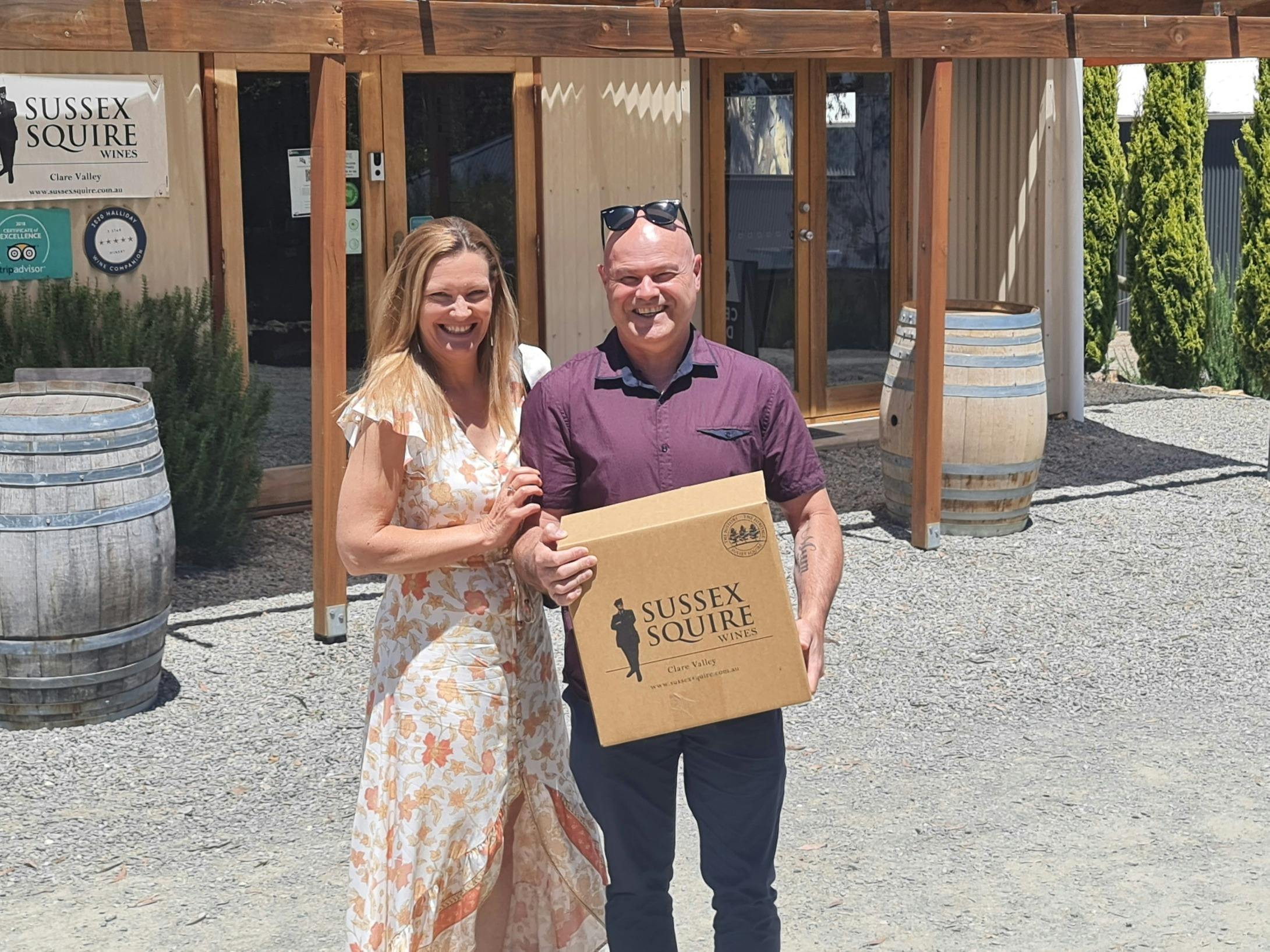 Customers with a box of wine