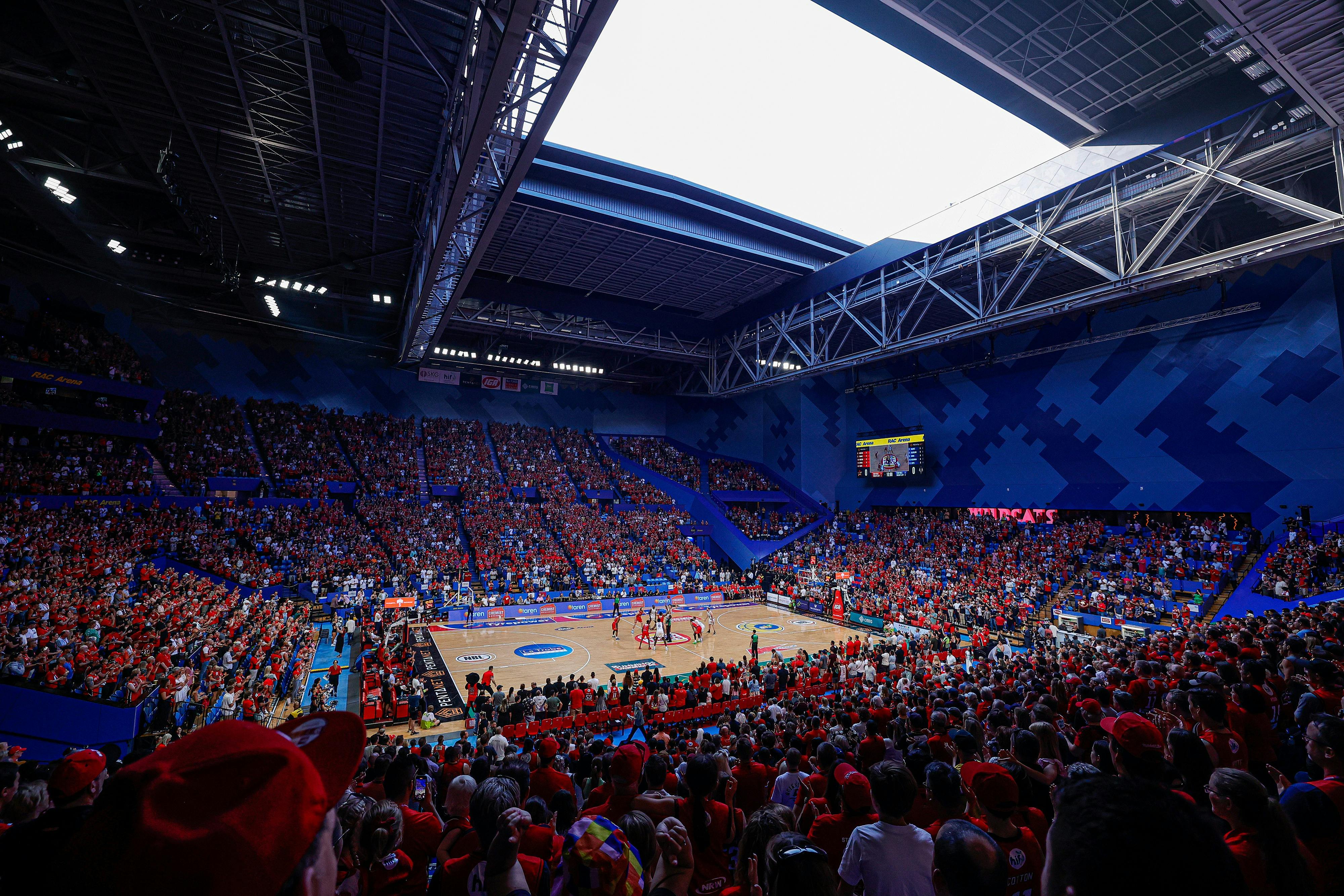 RAC Arena with the roof open and the stands full of basketball fans wearing red