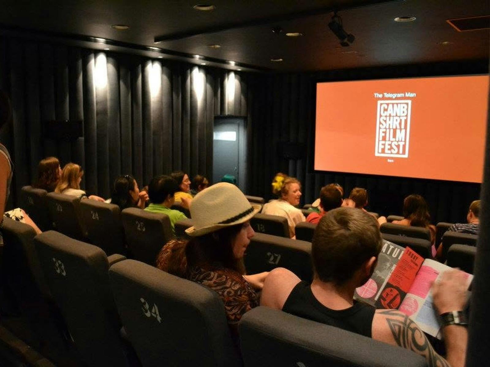 Cinema Screen showing CSFF logo with audience watching from right side